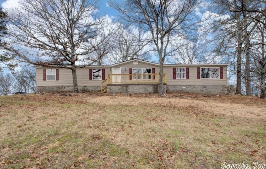 This spacious 3 bedroom 2 bath home is located on 4.92 acres and only minutes away for Lake Norrell.  This home has just been completely remodeled and features a new roof, new deck, new HVAC, new fireplace, new granite counter tops in the kitchen and both bathrooms, new light fixtures, new LVP flooring, new SS appliances, new carpet and more.  Don't miss out on this great space buy!!  This is a Fannie Mae HomePath property so go to www.HomePath.com for more information and to submit offers.  Seller may pay up to 3% towards buyer's closing costs for qualified buyers.  See Homepath.com for details.