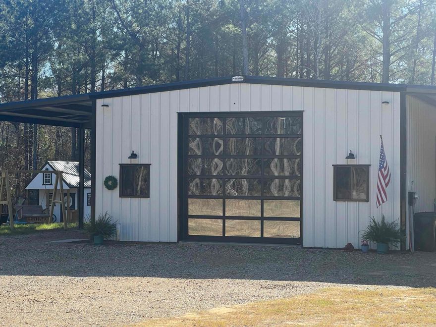 THIS PROPERTY OFFERS BEST OF BOTH WORLDS: AREADY TO MOVE IN HOME ON 6 ACRES WITH A WELL PREPARED SPOT FOR FUTURE HOMESITE. ADDITIONAL LAND IS AVAILABLE FOR PURCHASE THE CURRENT SHOP/HOME HAS 1890 SQ FEET, BUILT IN 2022.  LIVING AREA CAN BE CONFIGURED FOR 2 OR 3 BEDROOMS.  THE SPA LIKE BATH HAS DUAL SINKS, SOAKING TUB, SEPARATE SHOWER.  NICE LAUNDRY AREA THAT ALSO SERVES AS LARGE WALK IN CLOSET.  THE HOME FEATURES SPRAY FOAM INSULATION, VINAL PLANKING FLOORS AND STAINED CONCRETE.  A 2 INCH WATER LINE IS RUN FROM THE METER TO CURRENT HOME, WITH ANADDITIONAL LINE PREPPED AND LOCATED FOR NEW HOME.  A PAD-MOUNTED ELECTRIC TRANSFORMER IS READY FOR NEW HOME.  HOME IS WIRED WITH 50 AMP HOOKUP  FOR FUTURE GENERATOR NESTLED ON 15 ACRESOF BEAUTIFUL LAND IN GENOA SCHOOL AREA.  NICE TREES GIVE PRIVACY.