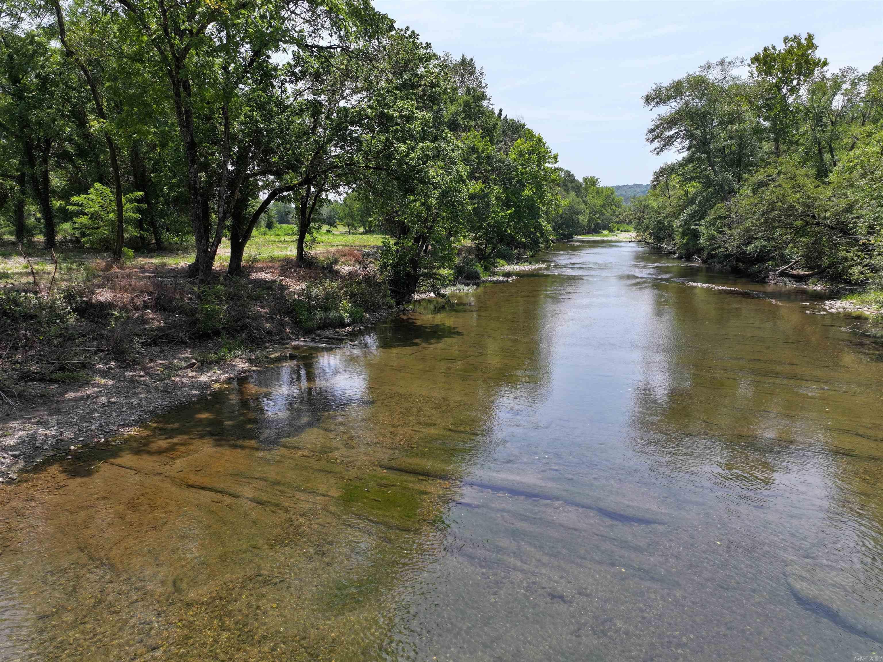 This stunning riverfront property in Norman, Arkansas, offers a unique blend of natural beauty and outdoor adventure, making it an ideal location for both relaxation and recreation. Nestled in the heart of the Ouachita Mountains, this property boasts proximity to a multitude of attractions and activities. Enjoy direct access to the waters of the Caddo River, perfect for fishing, floating, and unwinding in nature. With thousands of acres of national forest nearby, outdoor enthusiasts will find endless opportunities for hiking, wildlife viewing, and exploration.Just a short drive to Mount Ida, known as the Quartz Crystal Capital of the World, where you can dig for your own crystals. This riverfront property in Norman, AR, is not just a piece of land; itās a gateway to a lifestyle filled with adventure, relaxation, and the beauty of nature. Whether you are looking to build a permanent home, a vacation retreat, or a rental property. Agents see remarks.