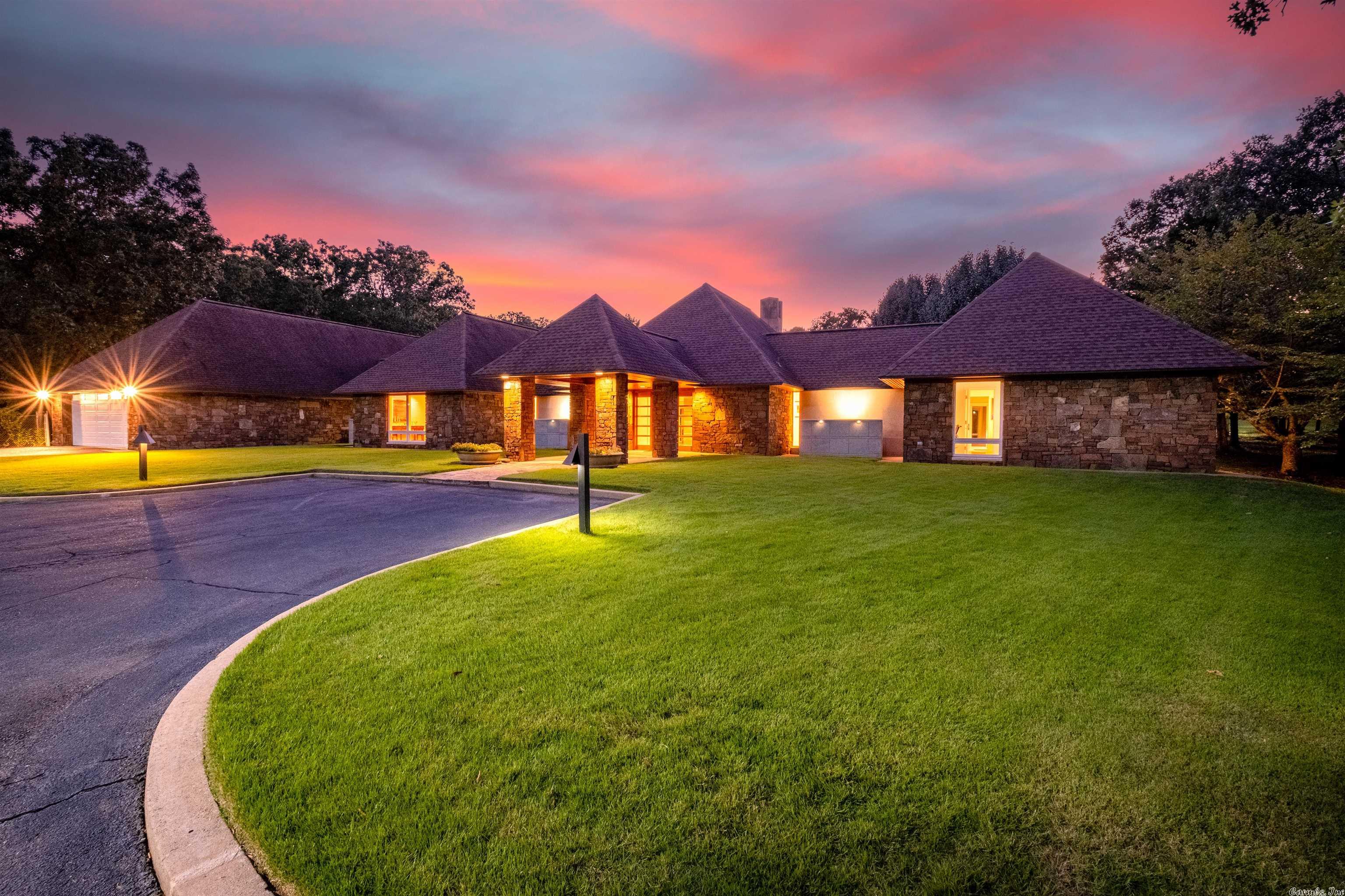 Stunning home & setting! Perfect location. Ultimate privacy on 5 acres in WLR. Designed by architect Steve Rousseau & custom built by AMR Construction. Flagstone pool & 13,000 sq. ft. patio. Main home has resort style master suite with view of landscaped park area. Updated chef's kitchen. Multiple living areas. Screened in sunroom w/outdoor kitchen. Commercial grade fully equipped 2 BR, 2 bath guest home & wine/entertaining building built in 2016. Tennis course & putting green. See Docs for complete info