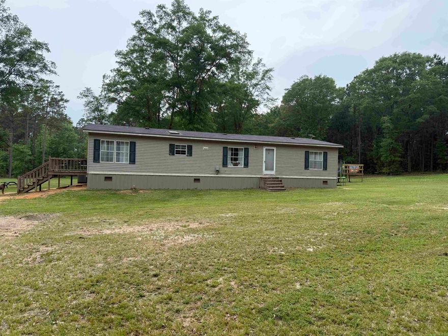 Looking for the perfect spot, country living, close to town with lots of privacy, this property offers approx 37 acres minutes from downtown Nashville, home offers approx 1,624 sq ft of living space with 3 bedrooms and 2 full baths.  This mobile home has been well maintained and is move in ready.  Large living room, spacious kitchen w/lots of cabinet space, pantry, dining area and laundry nook.  All appliances to convey, including refrigerator, dishwasher and electric range.  Split floor plan with large master, walk in closet, master bath with jacuzzi tub and separate shower.  Home is all electric, newer hot water heater and CH/CA unit replaced in 2023. Covered deck and additional detached large entertaining deck, storage building and shop building.  For more details or to schedule a private showing, contact our office.