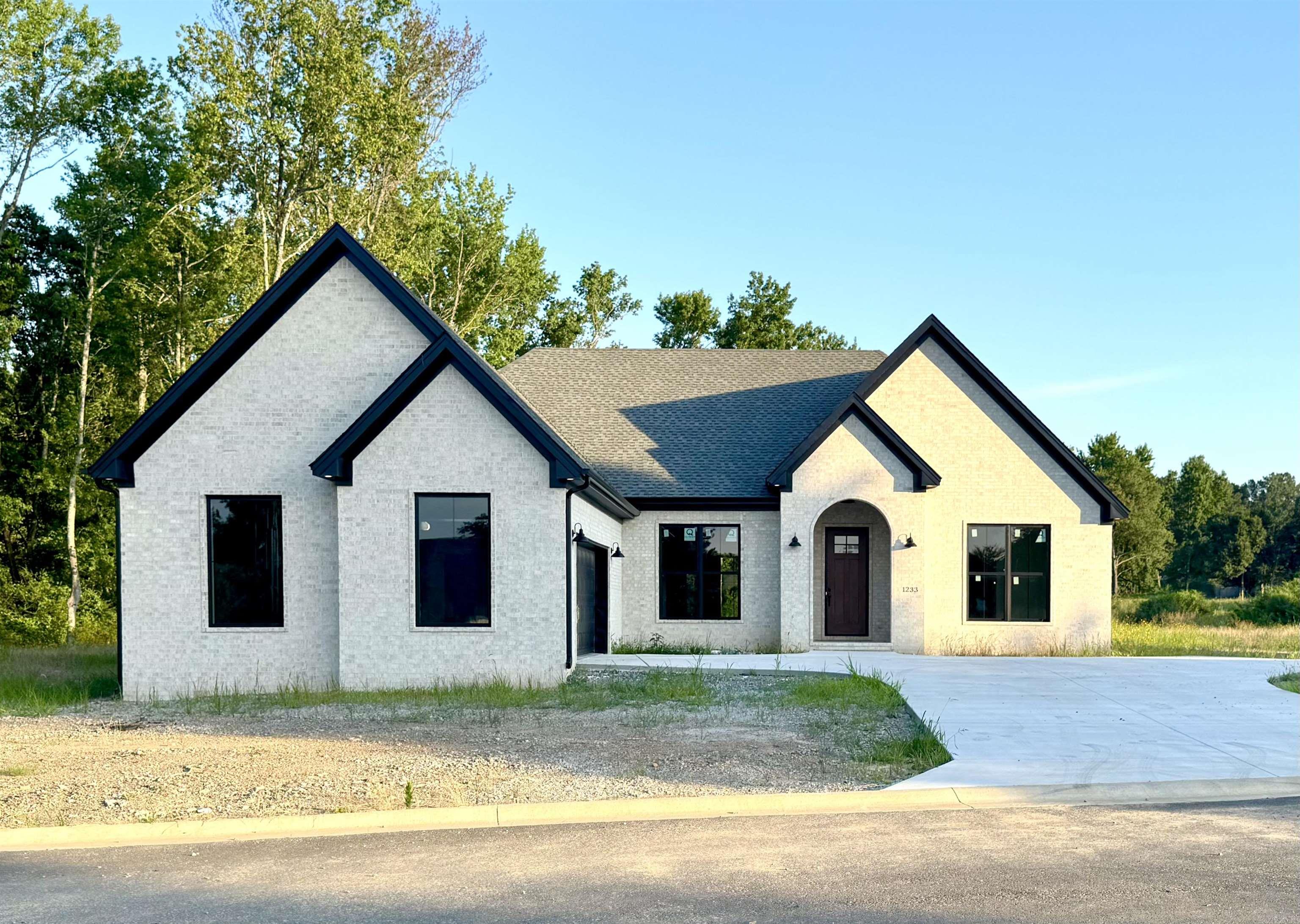 This stunning custom-built 4-bedroom, 3-bath home offers an open floor plan designed for comfort and functionality. The eat-in kitchen features a breakfast bar, walk-in pantry and ample space for family gatherings. A separate formal dining room adds elegance for special occasions. The great room with a cozy gas log fireplace creates a focal point. The primary suite boasts his and her walk-in closets, a large custom tile shower, and a dressing table for convenience. Enjoy outdoor living on the covered patio Located in one of Searcy's most desirable neighborhoods, this unique home is truly a must-see!