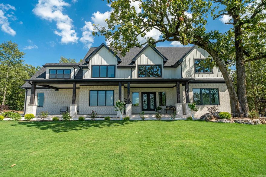 Modern Luxury with Panoramic Views!! This brand-new 4500 sq ft architectural masterpiece sits on 4 private acres in a gated quiet, and neighborly subdivision offering unmatched quality and privacy. Designed for visibility from every angle, this home offers sunset views from the back and stunning mountain and hill views from nearly every room. The chef's kitchen features high-end appliances, black granite countertops, opens to a spacious living area with grand porcelain tile, a massive fireplace, and bold black-and-white finishes. Highlights include 4 bedroom, 3 full baths 2 half baths. Game room-or 5th bedroom, office. Jack and Jill bath, dual laundry rooms, upstairs storage, 3 fireplaces, 5 mounted TV's covered outdoor kitchen with grill. Starlink internet, crystal-clear well spring water, 400 Amp system (ideal for a future shop), zoned HVAC, and hunting potential on your wooded lot. This home has been professionally landscaped and there is not a more beautiful home on the market!! No more lots available with views like this! Don't miss this rare opportunity! Call Tambra Lucas Today to view this fabulous home! 501-538-9722