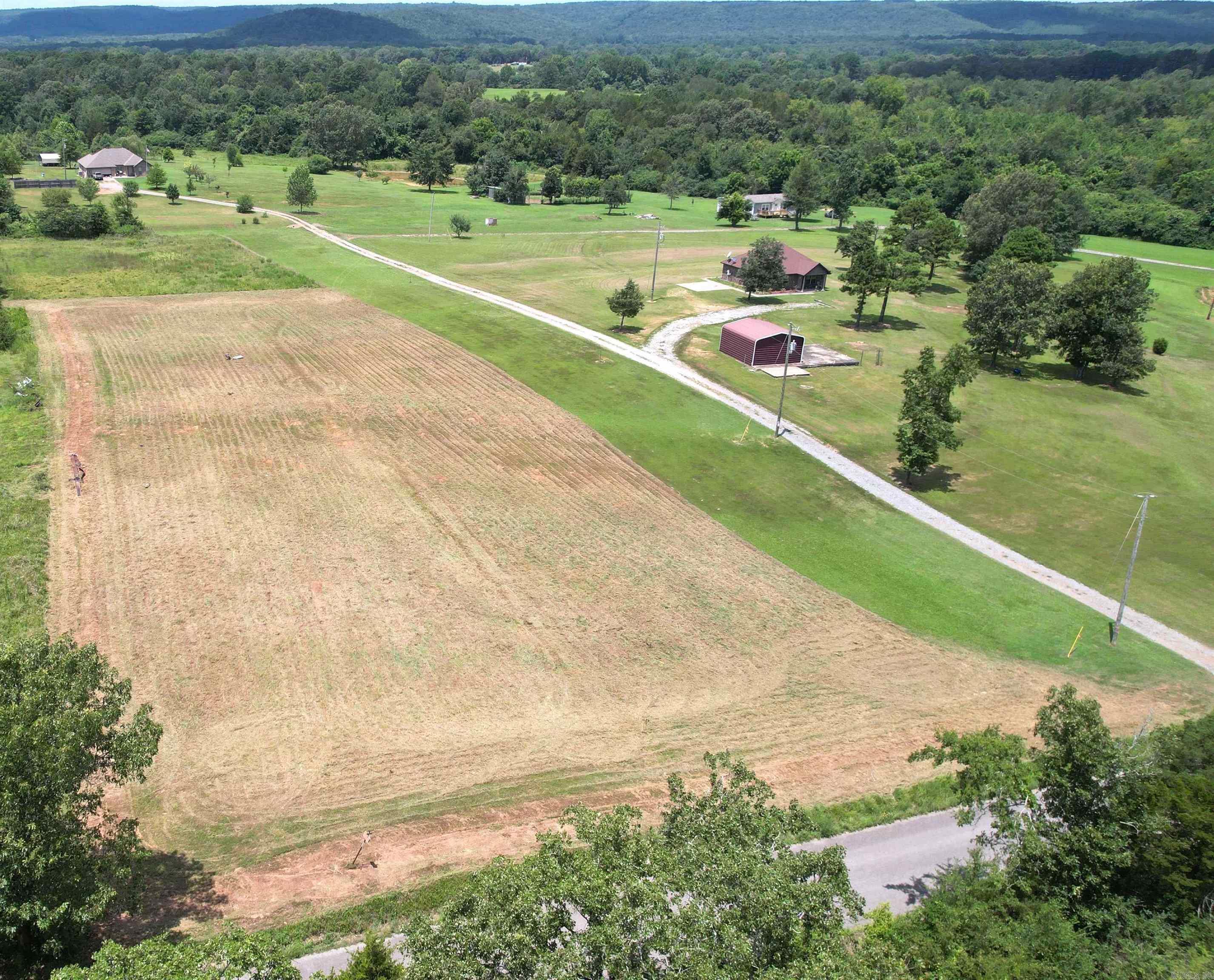This 2-acre slightly sloped parcel on Bloodworth Rd offers space, flexibility & easy access to town- just minutes from downtown Searcy. Paved road frontage & public water & electric at the road & it has also been cleared so it makes this tract ideal & affordable for your new dream home. No restrictions & mobile homes are allowed. Owner financing option available, reach out for terms if you have substantial down payment. See agent remarks.