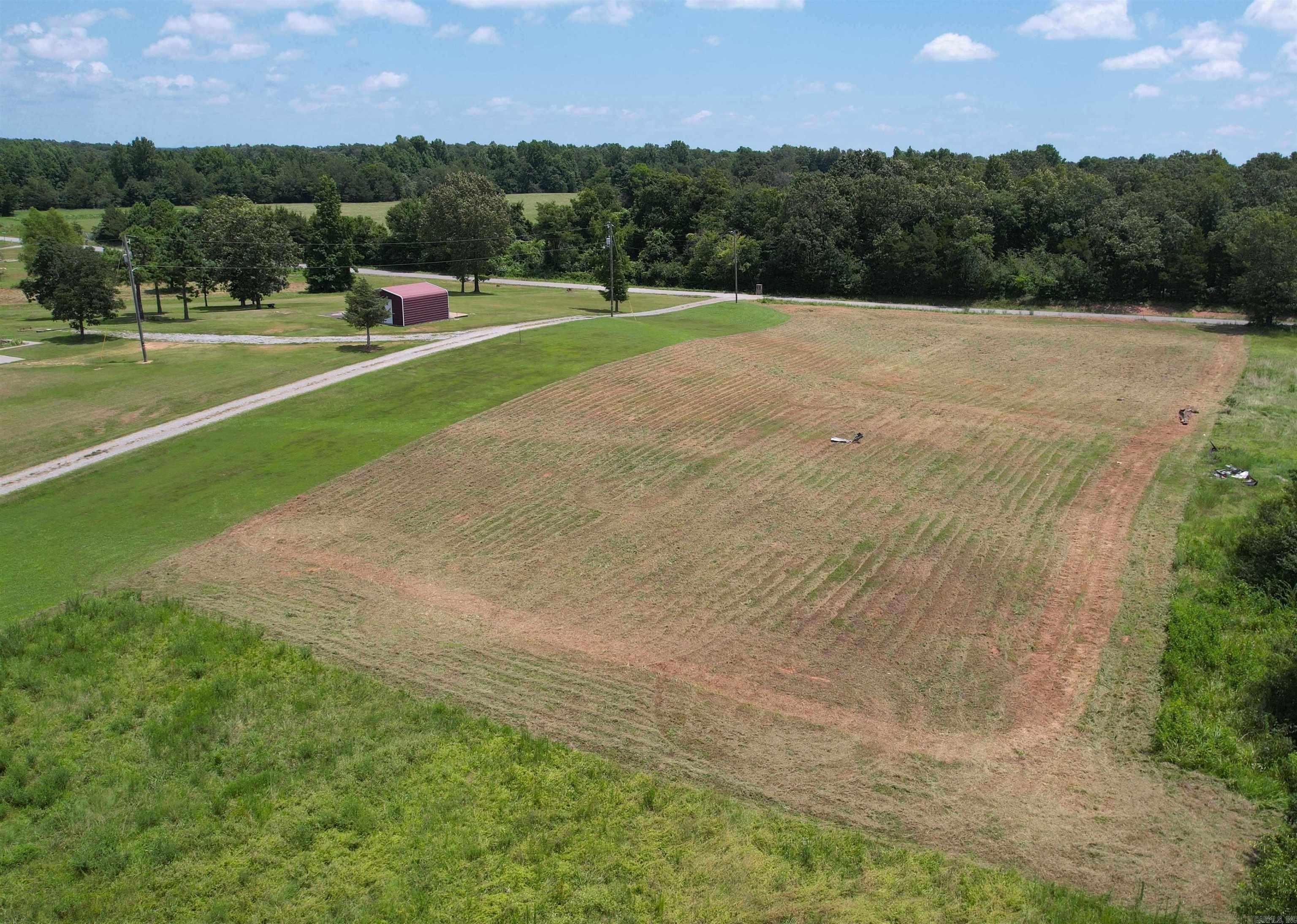 This 2-acre slightly sloped parcel on Bloodworth Rd offers space, flexibility & easy access to town- just minutes from downtown Searcy. Paved road frontage & public water & electric at the road & it has also been cleared so it makes this tract ideal & affordable for your new dream home. Perc Test has been complete & approved by White County for up to a 4 bedroom & 2,000 sq ft home or mobile home. No restrictions & mobile homes are allowed. Owner financing option available, reach out for terms if you have substantial down payment. See agent remarks.