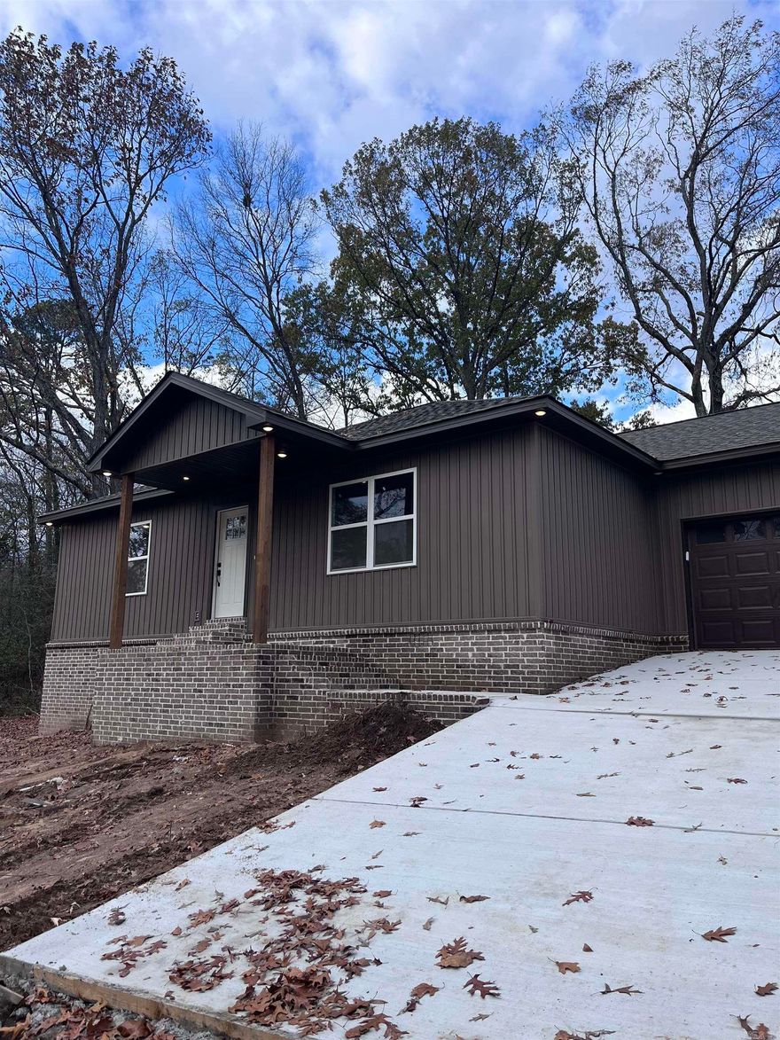 Great new construction in Historic Bauxite.  3 bedroom 2 bath home with oversized garage that looks onto woods from front porch.  Living room has beams in ceiling with electric fireplace. Spacious rooms with great closets.  Kitchen has quartz countertops and pantry with counter for small appliances. Split floorplan.  Luxury vinyl throughout.  Quartz countertops in bathrooms. Rural Development elegible. SEE AGENT REMARKS FOR BUYER INCENTIVES.