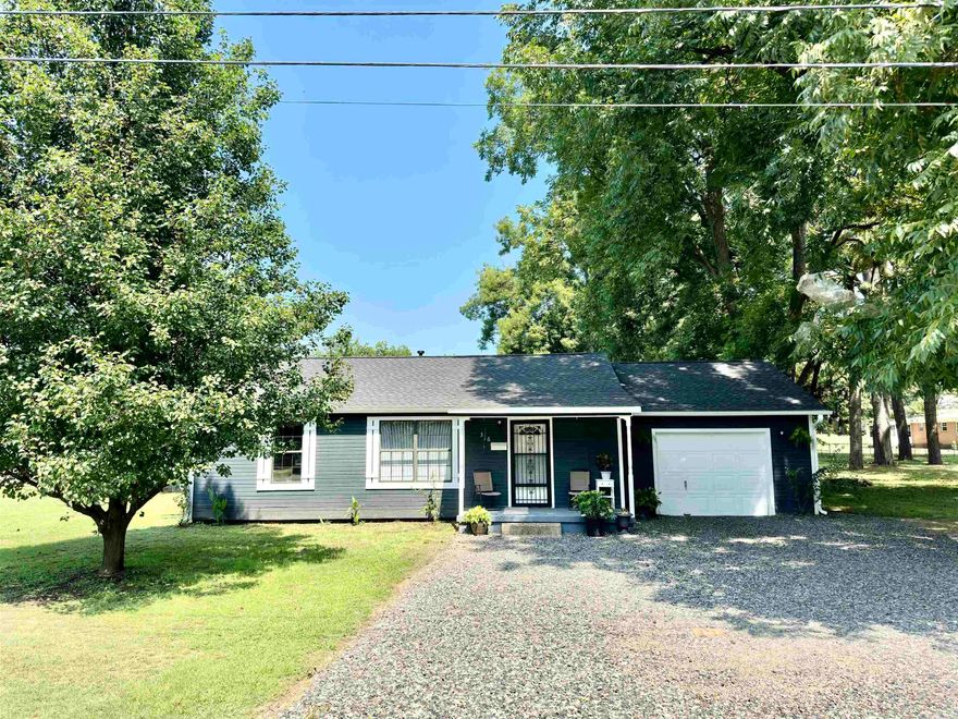 Prime Dardanelle Living! This charming 1,832 sqft home features 3 bedrooms, 2 full baths, and an expansive 20x25 bonus room with 10ft ceilings. Recently refreshed with new carpet, vinyl planking, fresh paint, stylish light fixtures, and a new roof with architectural shingles and a transferable warranty. There's also a 16 x 20 ft. enclosed garage with a 20 ft. long, sturdy work bench with pegboard for organizing tools. Set on a city lot with a fully fenced backyard and a covered deck, perfect for relaxing or entertaining. Ideally located next to the park and just minutes from all essentials. This home is a perfect blend of comfort and convenience—don't miss it!