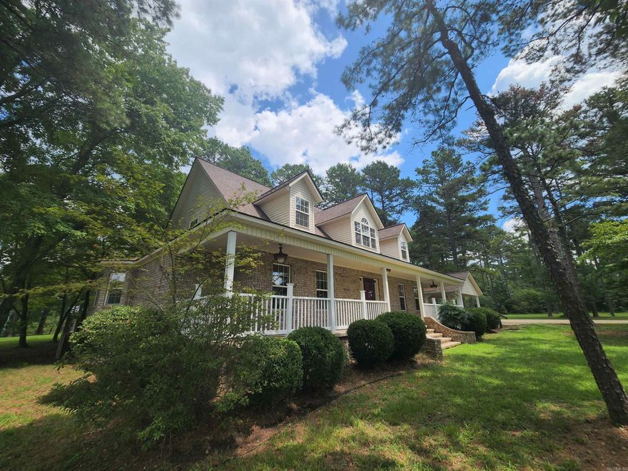 Tucked away on just over 14 peaceful acres, this country home offers privacy, space, and thoughtful features throughout. A concrete driveway leads from the road to the home, which includes a two-car carport plus extra parking. The main level features a primary bedroom, separate dining area, office, and a wrap-around covered porch ideal for enjoying the outdoors. Inside, you’ll find granite countertops, custom cabinets with under-cabinet lighting, tall ceilings, a large living room, and a real wood-burning fireplace. The home boasts two newer HVAC systems, and utilities include city water plus a well. French doors open to a detached 488 sq ft cabin with a full bath and kitchenette. outdoor storage and plenty of room for fresh gardens ro be grown!