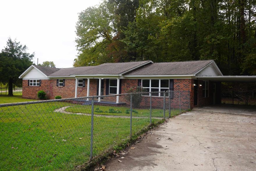 Check out this beauty situated on a corner lot in a very secluded area just waiting for someone to call her their own. Very spacious property that accommodates large families as well as small to medium sized families. This is an amazing, newly renovated property with practically everything new. This property has 2 living areas which will accommodate your family game nights and movie night. Check out the huge gourmet kitchen with the granite counter tops, stainless-steel appliances, island, and 4-chair bar. I imagine it would be a blast to cook in this kitchen. Not to mention, it would be so much fun gathering around the island with family and friends during holidays or any other event. Follow me down the hall to the bedrooms! Oh wow! Take a look at the spacious bedrooms. The master bedroom is huge and has an ensuite with a large walk-in closet. One of the bedrooms has a half bath. There is new flooring, light fixtures, paint, and more throughout. The exterior is all brick with a 2-car carport all on over a 1/3 of an acre lot. That is not only room enough for a garden, but plenty of room for the kids. Please do not miss out! Make arrangements to see this amazing property today!