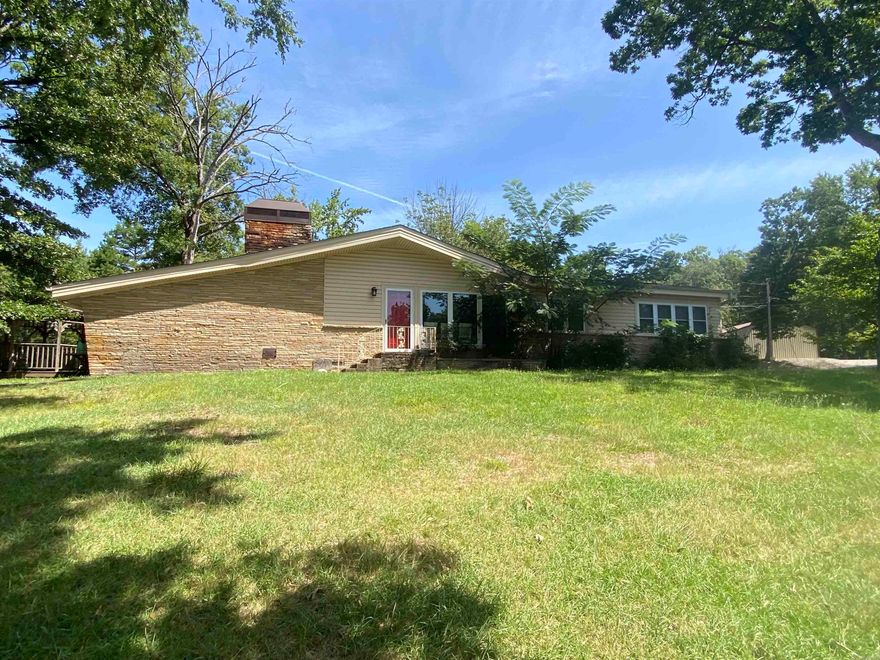 Reduced!! Here's a vacation home just for you and your family!  This is property is in one of the most desired locations in Montgomery County.  9 White Oak is located between Shangri-La & Lake Ouachita Shores (Denby Point) and you know how hard it is to find a place there!  With 3 bedrooms and 2 baths, this 1802 square foot home has plenty of room for all your family and friends to visit. Both the dining area and the great room feature the "exposed beam" feel on the ceilings. A lovely brick fireplace and an enclosed back porch, that is heated and cooled, are just a few of the extras you will love. The floors are tile and hardwood throughout for easy cleaning. Relax under the gazebo off the carport, which is a great place for grilling! This property includes 20'x30' shop & a 12'x25' boat awning, along with an outside storage area. Don't miss out on this one!  $250,000.00