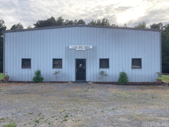 This 4000 sq ft well insulated metal building sits on 2 acres in a very high traffic location on Hwy 63. It has 16-foot side walls and one 12' metal rollup door. It has a heated and cooled front area with the back space currently used as a church. The possibilities are unlimited in this unrestricted area!