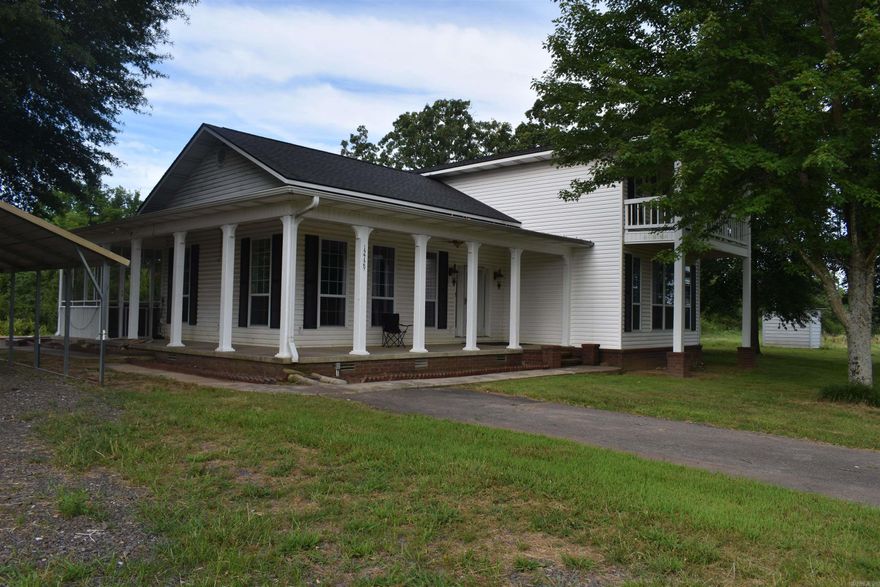 As you pull into the paved, tree lined driveway of this two-story custom home, youll immediately be able to see the country charm that surrounds this Scott County Estate. Sitting on 13 +/- Acres and totaling 2500 Square Feet heated and cooled, this property is spacious both inside and out. The custom-built home is full of features that separate it from your typical home. The high ceilings in the living area, along with the crown molding and loft overlook are just a few of these features. The home has a large master suite down stairs, along with a spacious kitchen, living area, and mud room. Upstairs, two bedrooms with a jack and jill style bathroom have beautiful views to both the north and south. A two-car carport, as well as an unfished detached two car garage giving plenty of space for all of your vehicles and outdoor equipment. On the west side of the yard, there are two camper hookups complete with power and water. The six-acre fenced pasture on the west side of the property is the perfect spot for cattle or horses, and has a stocked pond as well. This charming country home has a lot to offer, and is located in one of the most sought-after areas in the county.