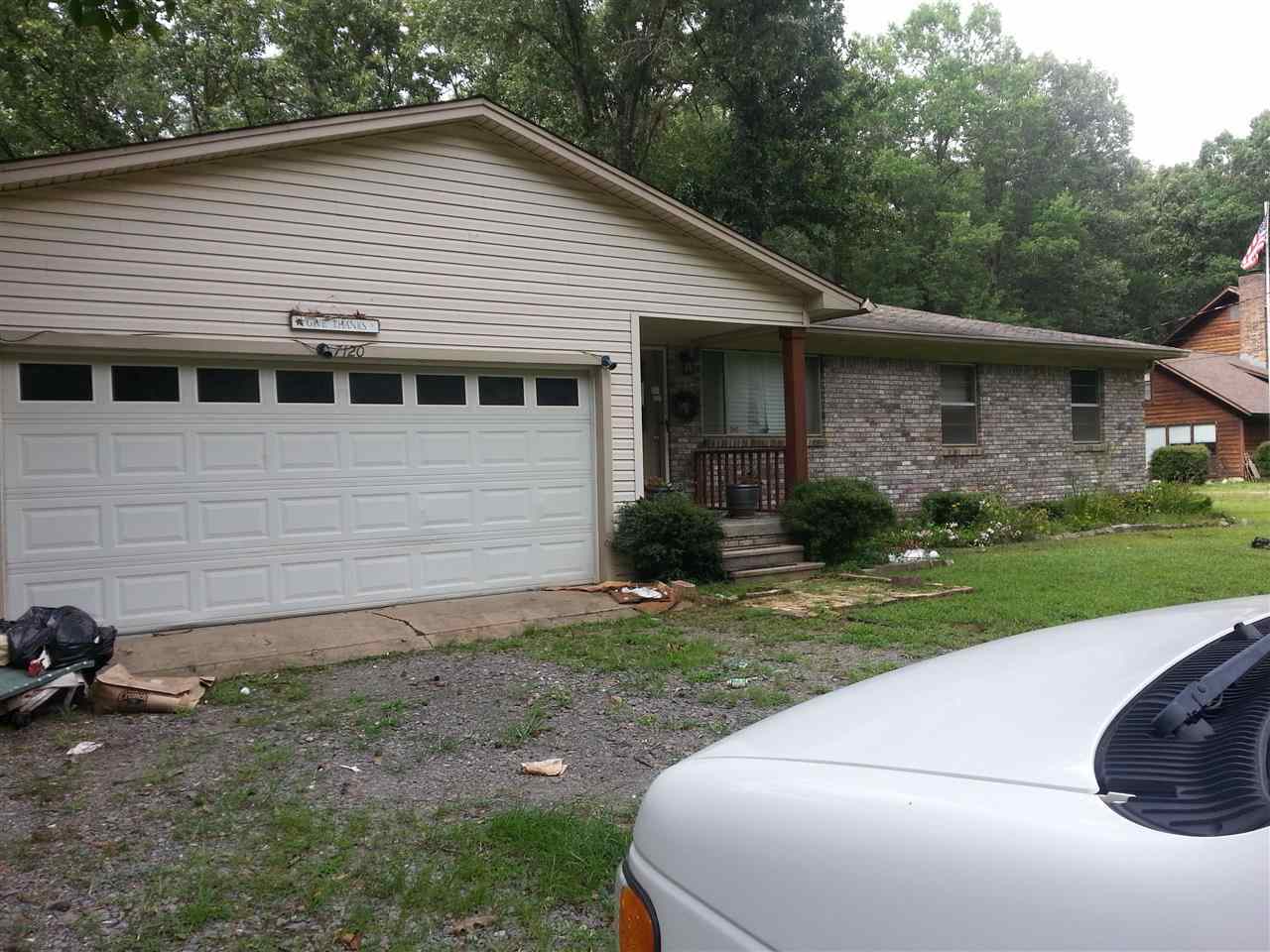 Home on nearly a half acre of land with green space in the back on the the side. 4 Bedrooms with 2.5 baths large kitchen family room combination. Great deck with hot tub and plenty of room for you morning coffee and to relax and watch the wildlife. With a little TLC this home will be a real showplace. Home has an extra two car garage with garage door openers that could be used as a garage or a work shop.