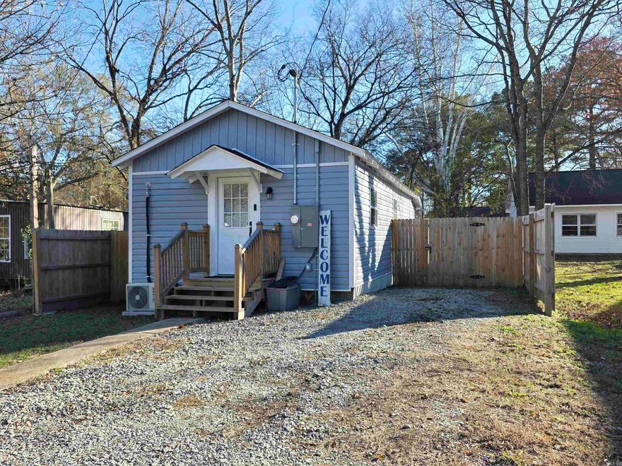 Don't miss out on this Cutie. This Tiny but beautiful home had a complete remodel by a replicable contractor in  May of 2024. So everything is still like new.  Enter this cutie off a small front covered deck into an open Kitchen/LR with all the appliances (only a year and half old) - good Cabinet Space so it has all you need for cooking/entertaining. Then a small hall leads to a nice size Bedroom then Great Bath with Laundry off of it. Finish at the back door with a great Mud space area out to a covered back porch and Huge Fenced in Yard. Great location in a nice neighborhood. House is heated/cooled by Mini Split that is only 1 1/2 year old.  Sq ft est, pls measure.