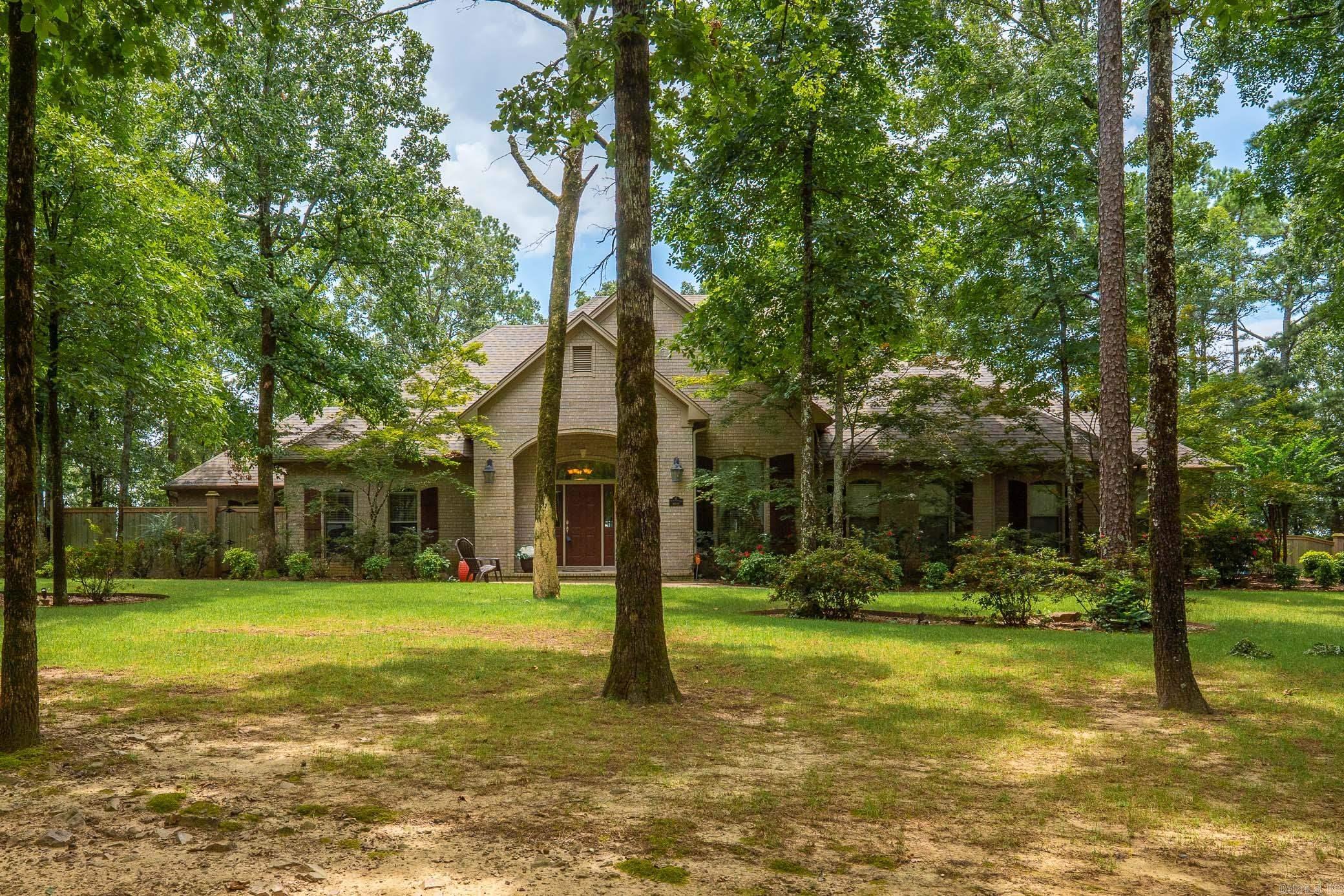 Wonderful Dogwood Estates property with 6 bedrooms, 4 1/2 baths, 3 living areas, nestled on 3.25 acres of scenic beauty in Conway! The beautiful living room with fireplace, formal dining room & sunroom create a warm, inviting atmosphere with abundant natural light & access to the outdoor living areas. The kitchen is a chefās dream complete with stainless steel appliances, double ovens, gas range, and two expansive islands offering both function and flow for entertaining. This spacious home offers 5 generously sized bedrooms on the main level each w/large closets. The primary suite has tray ceiling, fireplace & large bathroom w/double sinks, walk-in shower & separate tub. 6th bedroom & full bath upstairs alongside a versatile bonus room with kitchenette/wet bar perfect for a media space, game room, or playroom. Outside enjoy the spacious deck & screened-in porch offering breathtaking views of the surrounding area. The home also features a large three-car garage with a workshop area.