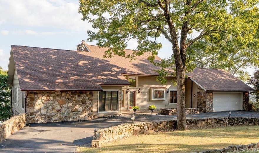 The views of Greers Ferry Lake do not get any better than this! This beautiful property sits on over an acre with extra landscaping that blends perfectly with the natural surroundings, creating a peaceful and private setting. The home features a newly remodeled kitchen offering functional and attractive accent lighting, stainless appliances and gas cook top. A new roof, updated HVAC systems, and a generator panel provide peace of mind and low-maintenance living. Enjoy the well-kept tiled garage with sink and cabinets, in-ground Rainbird sprinkler system, and Wi-Fi-controlled garage door and thermostat. Outdoor living shines with two spacious decks offering incredible lake views—ideal for relaxing or hosting guests. The additional living space/gameroom downstairs is sure to entertain your company with another fabulous view. Beautiful rock detail in the front yard surrounded with a convenient circle drive and an extra parking pad. Wildlife is abundant, making this home a true nature retreat. Whether you’re seeking a peaceful retreat, full-time home, or retirement dream, this lake-view property offers the perfect blend of comfort and natural beauty.