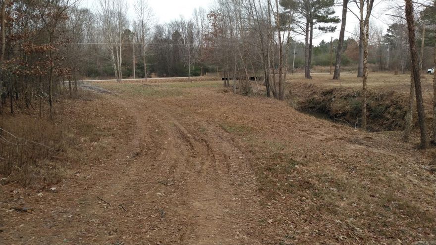 Discover the perfect blend of country space and town convenience with this 7.71± acre property for sale near Bald Knob, Arkansas. Ideally located just minutes from Harp’s Grocery Store and the city ballfields, this tract offers easy access to everyday amenities while still providing the privacy and flexibility of rural acreage. The property features a 1,200+/- square foot barn, ideal for equipment storage, hobbies, livestock, or future improvement plans. With utilities available nearby, much of the groundwork is already in place for a future home site, barndominium, or weekend retreat. The mostly open acreage offers plenty of room for gardening, recreation, or small-scale farming. An added bonus: the adjacent acreage is also available for purchase, giving buyers a rare opportunity to expand their footprint, increase privacy, or invest in additional land close to town. Whether you’re looking to build, invest, or secure a manageable piece of land in a convenient location, this property offers outstanding potential. Enjoy peaceful surroundings with the benefit of nearby amenities in this desirable White County location. Seller does not own Mineral Rights. Minerals do not convey.