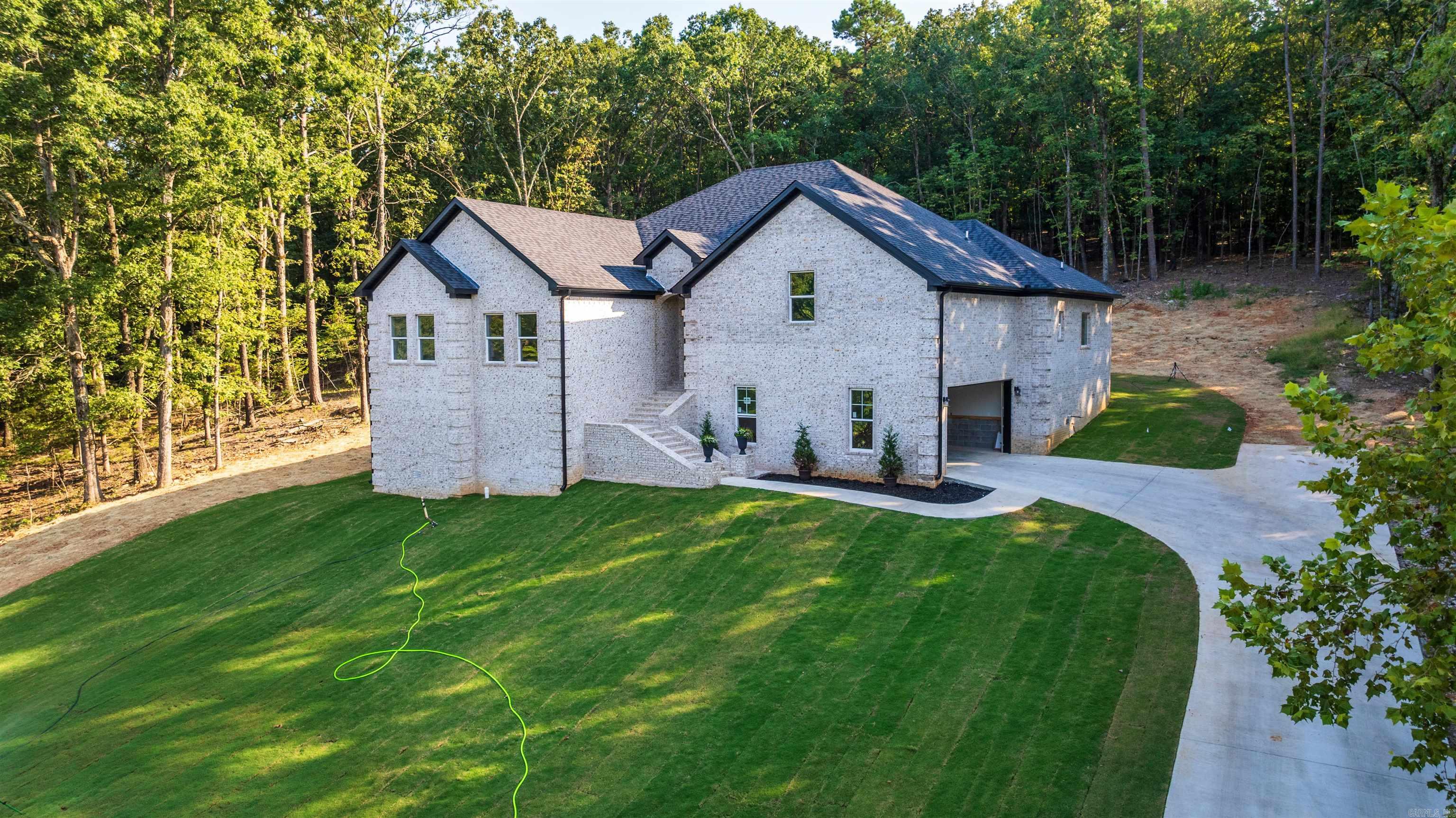 This stunning 5-bedroom, 3-bath brick home offers modern design, timeless style, and an unbeatable location just a stone’s throw from Eagle Mountain Golf Course. Inside, you’ll find an open-concept layout filled with natural light, perfect for both everyday living and entertaining. The gourmet kitchen showcases quartz countertops, sleek black fixtures, stainless steel appliances, and a large walk-in pantry. The main floor features 4 bedrooms, including a private primary suite with a laundry room conveniently located just off the master bedroom. Upstairs offers a 5th bedroom or bonus room — ideal for guests, a game room, or a home office. Step outside and take in beautiful views while watching deer roam the area — the perfect blend of nature and convenience. Location perks: golf, shopping, and dining just minutes away!