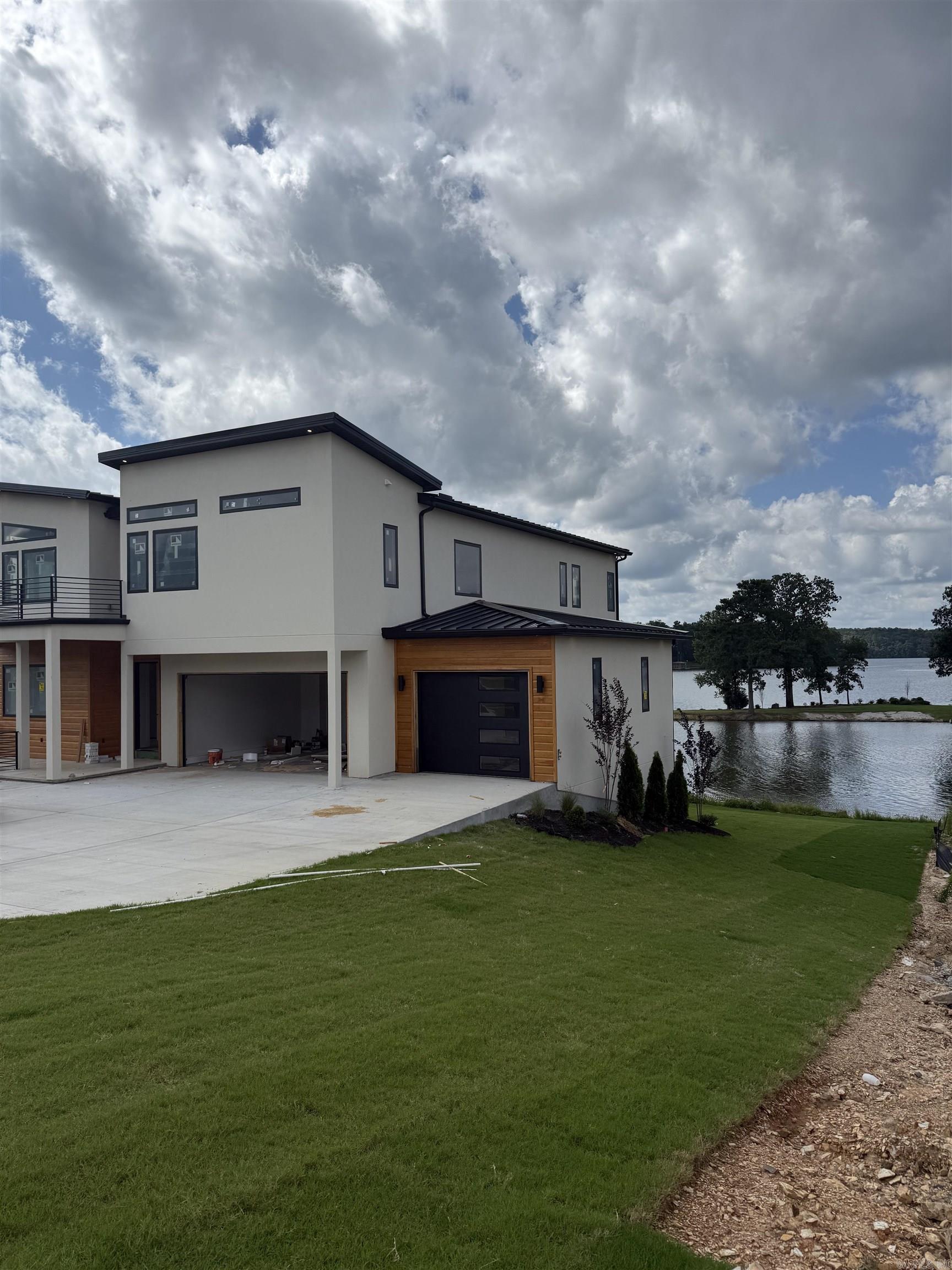 Make this premier location on the water with main body expansive views and over 100 ft of flat water frontage your dream home. Luxurious and warm modern construction with five ensuite bedrooms spanning over 3 different levels. Will make the perfect spot for hosting all the friends and family. Two levels of decks for that view you have been dreaming of. You still have time to work with designer on picking out the finishes.