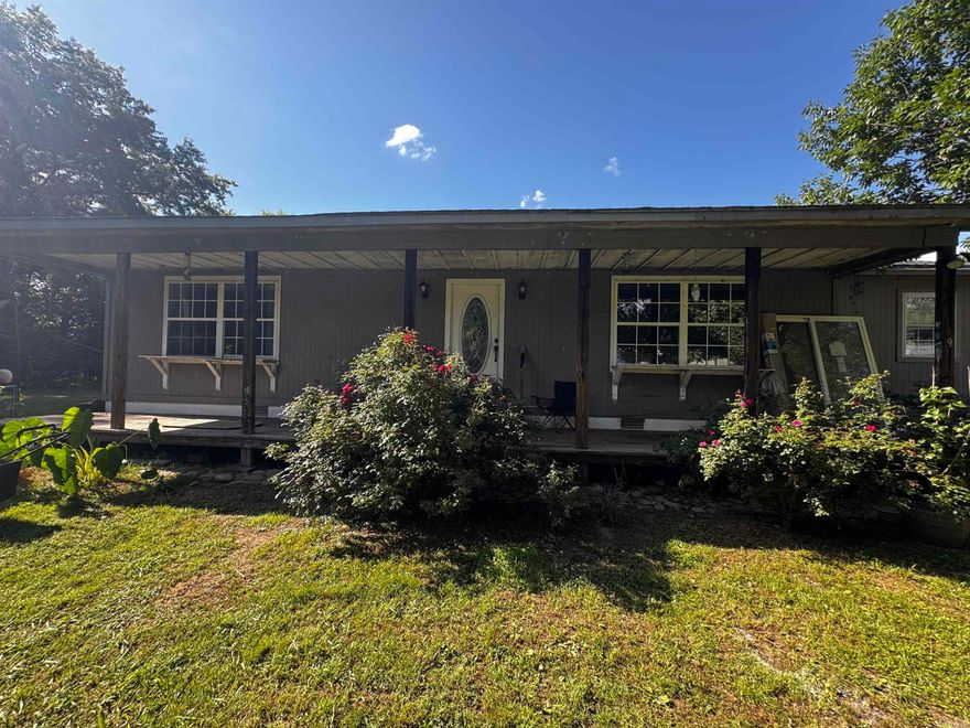 INVESTORS! Two for the price of one - 9052 highway 64 is a 1584 sq ft home with tall ceilings and an open floor plan. This home offers a very large primary suite with a large garden tub and walk in tiled double shower. The large lot offers room to grow and play!  There is a manufactured home with electric and water on the property that’s ready to be demolished and moved to put in your dream  shop or remodeled into a secondary home.