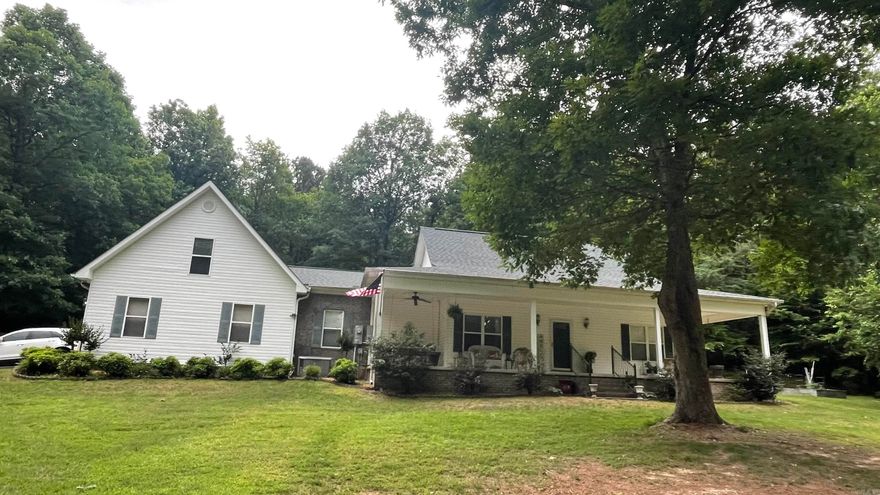 Welcome to your dream home on 3 peaceful acres!  Enjoy your den which has a brick fireplace and wood floors and looks out on the back yard. This spacious 3 bedroom 2-1/2 bath home features a large bedroom suite with an expansive bath, perfect for relaxing.  Kitchen countertops are granite and there is a Delta touch faucet. The formal dining room and bonus room (currently used as an office) give you flexibility for work or gatherings.  The interior was painted in 2024, heat/air October of 2022, roof 2023, and the driveway was treated in 2022. This is an all electric home except for the generator which uses the propane tank on the property.  Imagine enjoying sitting on the wraparound porch in the mornings with a cup of coffee.  The 30x50 shop (big enough for a large RV) and 12x18 Morgan building are ideal for hobbies or storage.  There is a security system and seller is willing to leave the refrigerator.  Sellers are selling property "as is."  Don't miss this rare opportunity - schedule your private tour today!