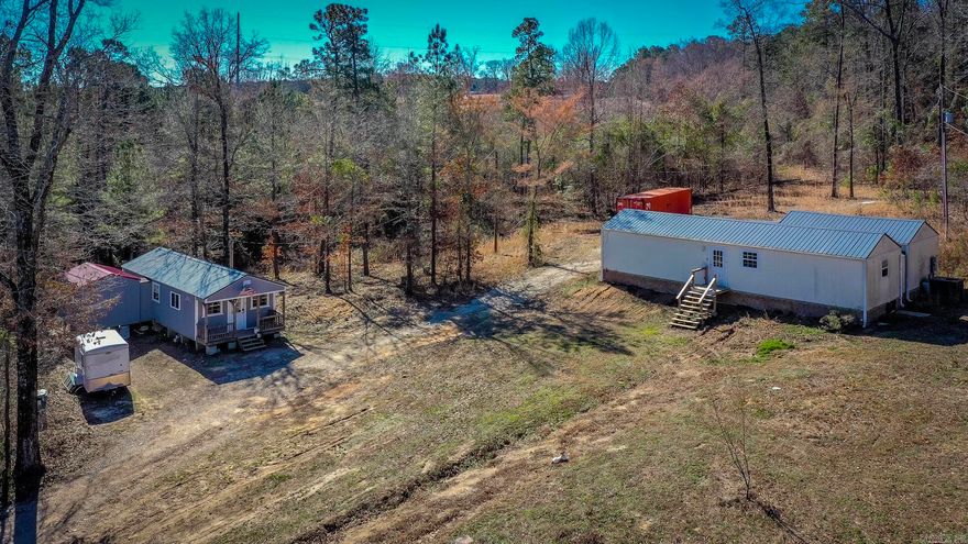 Just minutes from the Lennox Marcus boat ramp on beautiful DeGray Lake, this unique 6+ acre property offers the perfect blend of privacy, versatility and scenic charm.  Featuring two cabins, it is ideal for a weekend getaway, income-producing investment, or full-time residence. The first cabin offers approximately 920 sq ft with 2 bedrooms and 1 bath, while the second provides approximately 1,200 sq ft with 1 bedroom, 1 bath and a spacious living area.  Both cabins include their own laundry rooms for added convenience. Relax & unwind in your private hot tub, enjoy the peaceful mountain view, or take advantage of the miles of walking/ATV trails in the area. With lake access just minutes away and room to roam, this property delivers both recreation and retreat in one incredible setting.  Price to sell, this opportunity will not last long.  Schedule your showing today.