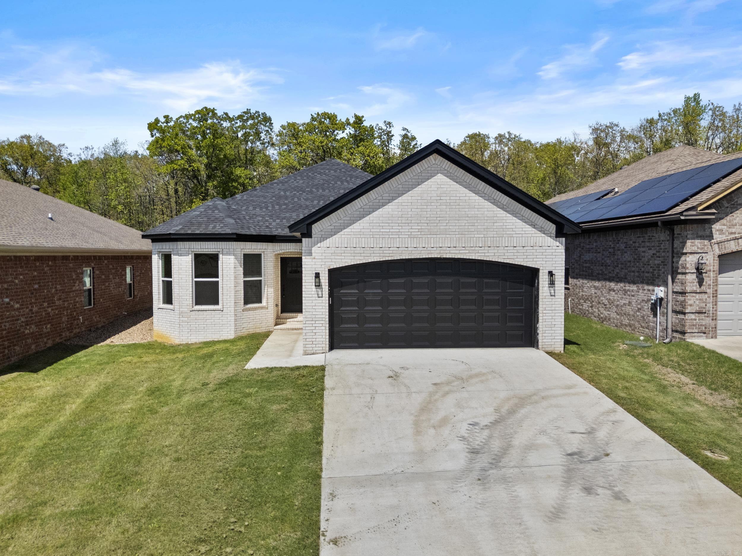 Affordable New Construction in Sherwood. This home is beautifully built with attention to detail. Covered porch in the front and covered patio in the back. All brick for easy maintenance. 9'-10' Ceilings throughout. Granite counter tops. Granite Waterfall Island in the kitchen. Stainless Steel appliances. Crown molding throughout the home. Windows capped and trimmed. Walk-in master closet. Hardwood floors in living room, kitchen, and dining area. All electric for easy maintenance.