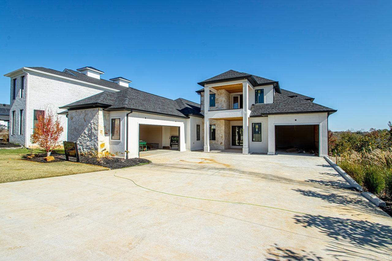 STRATEGICALLY PRICED!! Surrounded by lush landscaping & sprawling approx. 1/2 acre of serene privacy, nearby walking, biking & dining, this new LUXURY RESIDENCE is located in the beautiful development of Stone Hill & CHECKS ALL THE BOXES of LIVING YOUR BEST LIFE! The allure of this striking, one-of-a-kind residence boasts expansive floor-to-ceiling windows maximizing an abundance of natural lighting! Open concepts with every detail covered making your vision of a custom home a reality! Exceeding all expectations, this stately home features exotic stone walls, luxury lighting & gorgeous flooring! Enhanced entertaining with DUAL KITCHENS each with distinct purposes! EXCELLENT PANTRY with LOTS of built-ins! Exotic granites throughout the primary kitchen & ABUNDANCE OF CUSTOM CABINETRY, SLEEK & ROBUST APPLIANCES, & HIGH-END FINISHES! Transform your living experience to the NEXT LEVEL while balancing aesthetics & functionality! Customize your workout w/a PRIVATE FITNESS or ENJOY GAME DAYS & MOVIES in the large THEATRE & MEDIA! Totally detox on three spacious balconies while enjoying that beautiful sunset & light breeze! Lavish primary suite & dual massaging shower! Immeasurably more!