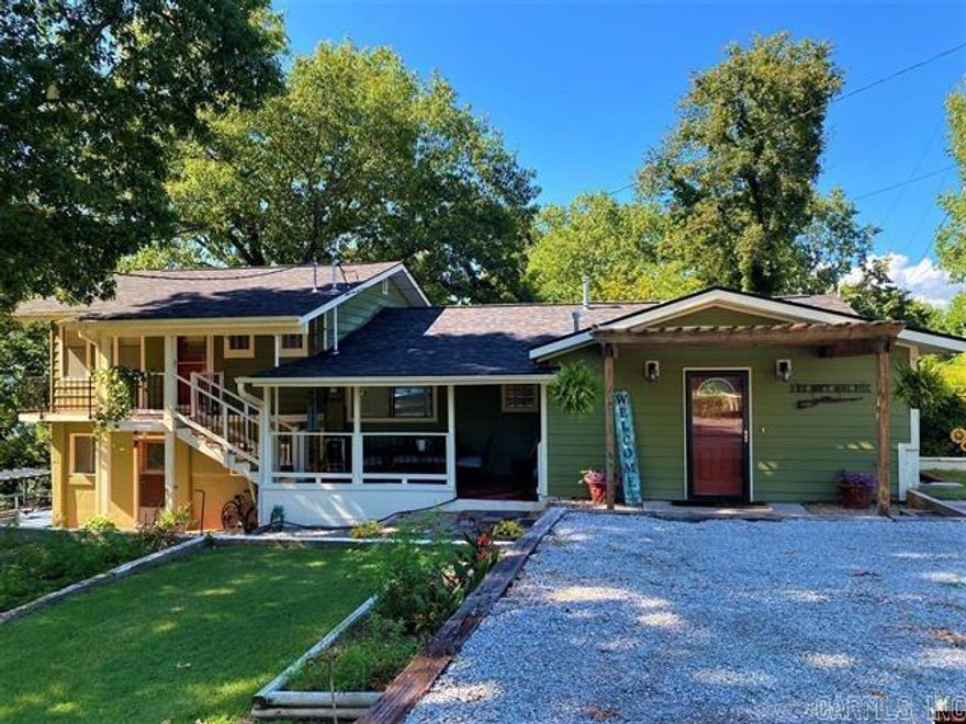 Beautiful lake home bordering government strip that you can walk to the water from your own backyard with a Corp approved 2 stall boat dock location that can all be potentially yours. Main part of the house features a fireplace for those cozy evenings and a hot tub for relaxing in, plus a new roof in November2022. Enjoy the beautiful kitchen that boasts granite countertops, stainless steel appliances and a gas range. This lake home has more than enough room for a large family or a vacation home. The partial views of the lake and outdoor deck areas makes this home scream Relaxation! Not many homes within walking distance of the lake with a Corp. approved 2 stall boat dock location that you can walk to from the house.