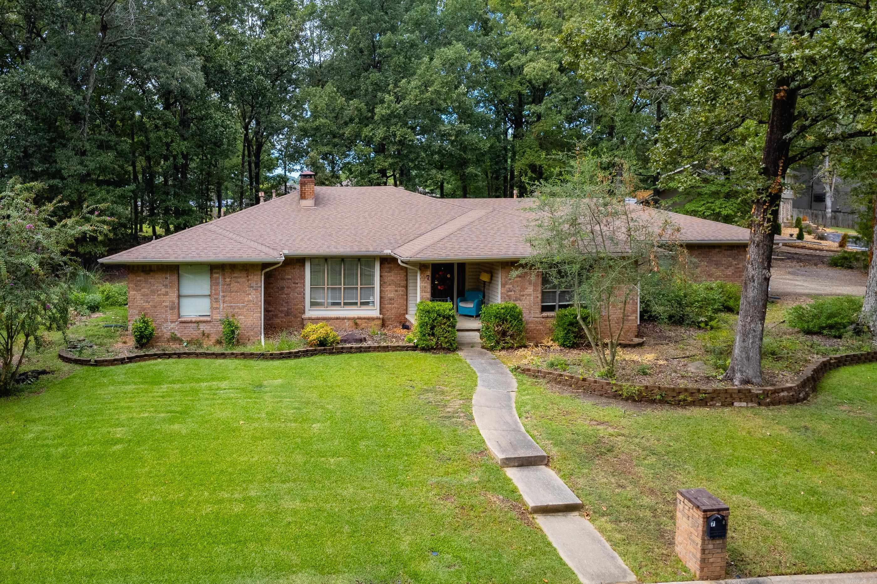 This mid-century, single-level home sits on a spacious half acre lot in a private cul-de-sac, offering golf course views, mature trees, and the feel of quiet country living right in the heart of Maumelle. Inside, you’ll find granite counters, custom cabinetry, and vaulted ceilings, along with a workshop and sprinkler system. A lifetime foundation warranty (2019) is already in place, and an estimate for additional foundation work has been obtained, giving buyers clarity on the home’s needs. Being sold as-is, this property offers a great opportunity and location for you to bring your updates and personal touches to life. With its combination of space, setting, and potential, it’s a rare opportunity in one of Maumelle’s most desirable areas. Also, available VA assumable loan. See Agent Remarks