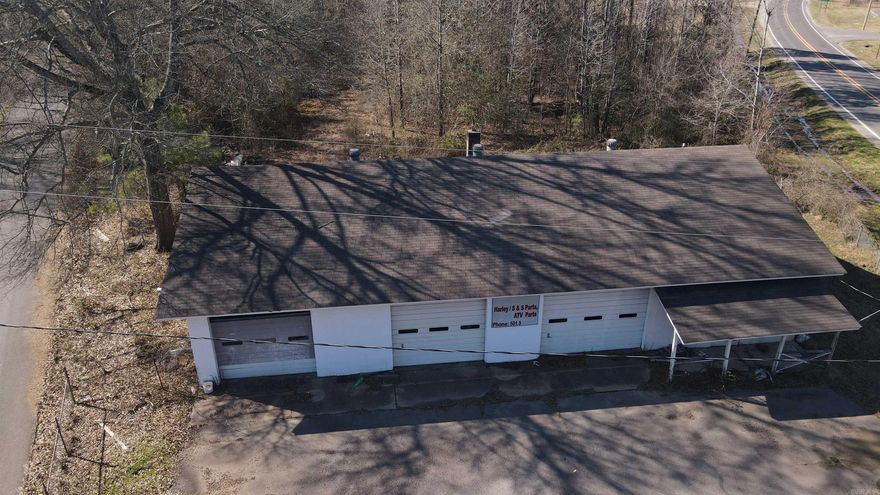 Great location, this shop and 5.5 acres is located in a prime intersection and high traffic area for any business.  The quick access to surrounding towns of Malvern, Benton, Poyen and Sheridan make it some prime property. It has 3 garage bays, office area, bathroom, office area, fenced lot and plenty of room for expansion.  Wood or gas can be used for heat.  The remaining acreage is directly behind the building.  A newly paved road runs directly behind the property giving access to Hwy 270 as well. New roof being installed in the next 30 days.