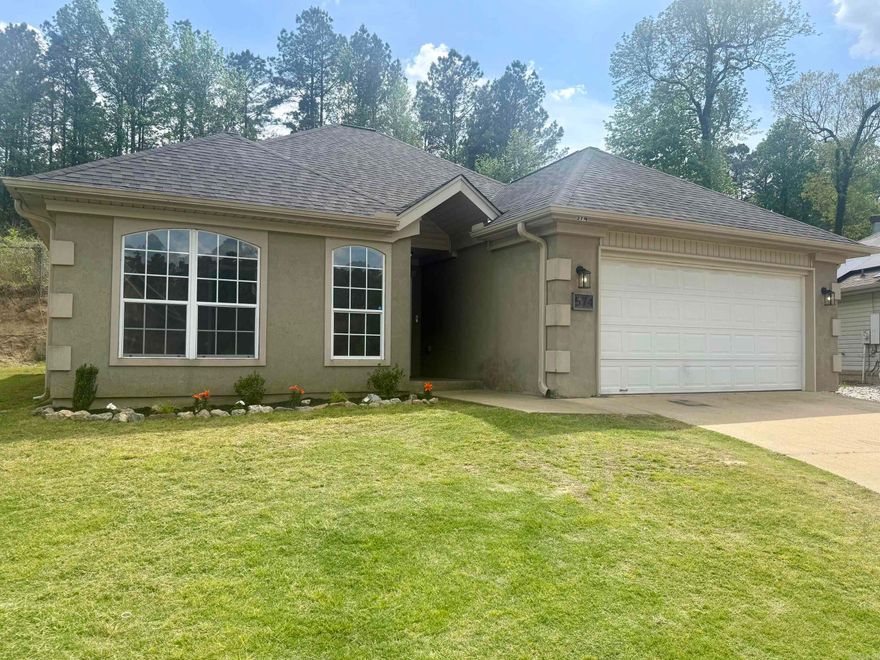 Welcome to this adorable 3 bedroom, 2 bath home located in the highly desirable community of Bauxite! This charming property boasts a fantastic location, providing easy access to excellent schools, making it perfect for families. Step inside and be greeted by a spacious, open living area, perfect for entertaining or relaxing with loved ones. Fresh updates throughout, including a brand new roof, ensure peace of mind and lasting quality. The kitchen features stunning new butcher block countertops, enhancing both the functionality and the aesthetic appeal of the space. Additionally, the primary suite has been beautifully updated, creating a serene and luxurious retreat. Don't miss the opportunity to make this wonderful home your own!