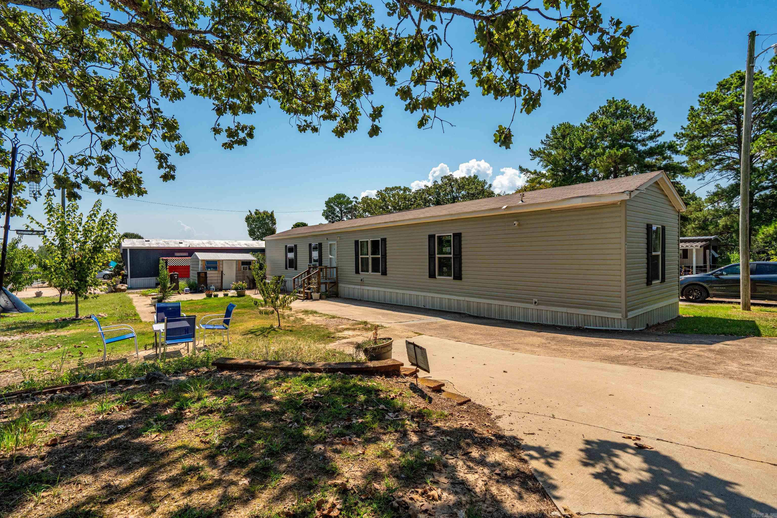 Welcome to this well-kept 3-year-old mobile home located in the desirable Timber Crest Homes community. This home has been lovingly maintained and is move-in ready, offering a clean, comfortable, and inviting living space. Enjoy the peach trees and the plum and pluot trees!! FYI: And they love to can in the summer so there is an added window unit in the kitchen for those days. NOT because the air condition isn't enough to cool the home. Situated on a double lot, the property provides plenty of outdoor space along with two additional buildings—perfect for storage, a workshop, or hobby space. Timber Crest offers a community environment with opportunities for recreation, making it a wonderful place to call home. The sellers are moving on to their next chapter, giving you the chance to make this beautiful property yours. Don’t miss out on this fantastic opportunity! Agents: see notes for park information and such.