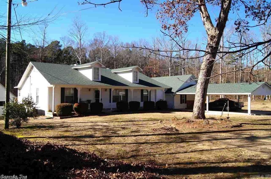 This is country living at its best! This family home has 4 bedrooms plus an office, 3 bathrooms, and 2 living areas! The home sits on 2.5 acres and backs up to beautiful woods and includes a pond, storm shelter, storage building, hot tub, and a screened-in back porch. The master bedroom suite has a Jacuzzi tub with a separate shower and two walk-in closets. The greatroom has vaulted ceilings and a cozy fireplace. Take a look at the pictures...this is a beautiful home! See agent remarks.