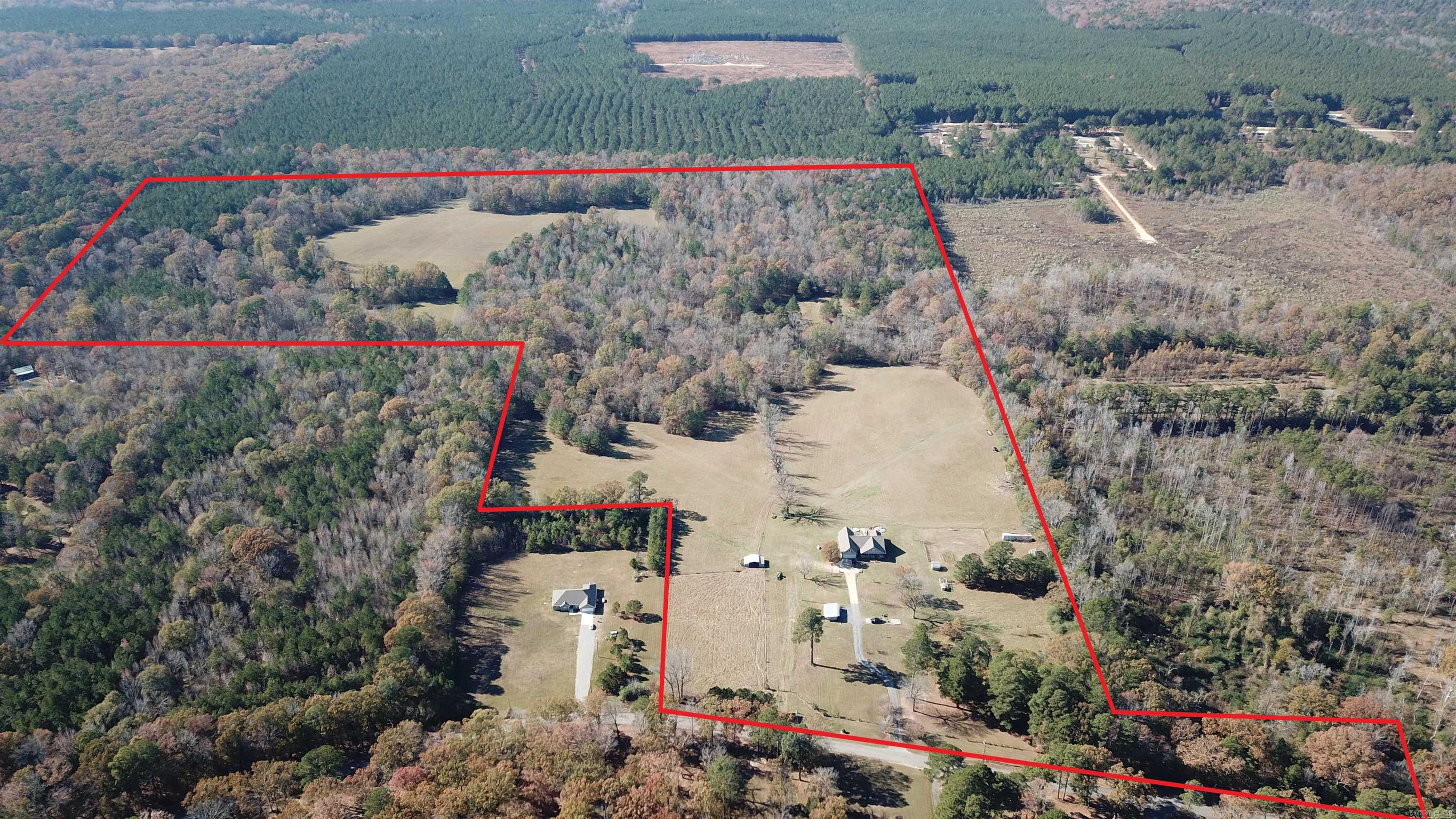 96+/- acres with a very nice country style home containing 3 bedrooms 2 full baths and a half bath with a bonus room and safe room.
