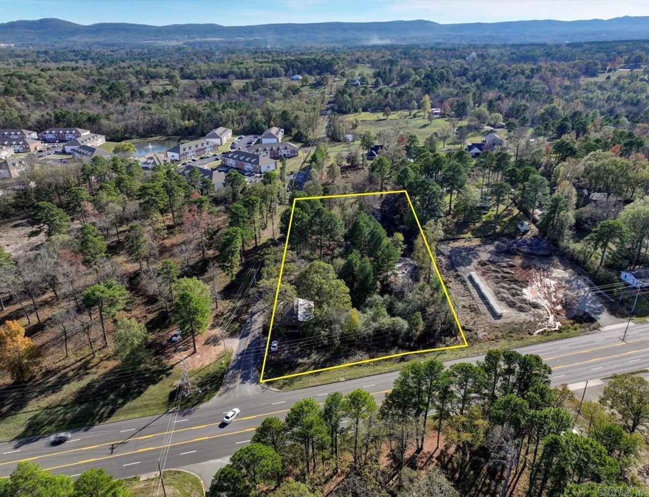 This property is ripe and ready for development with huge commercial potential on a corner lot in a high growth area along Airport Road. Frontage on three streets and excellent access with visibility from 4 Lane Highway with center turning lane. Daily traffic count of 26,000 cars per day. The value is in the lands, not the buildings.
