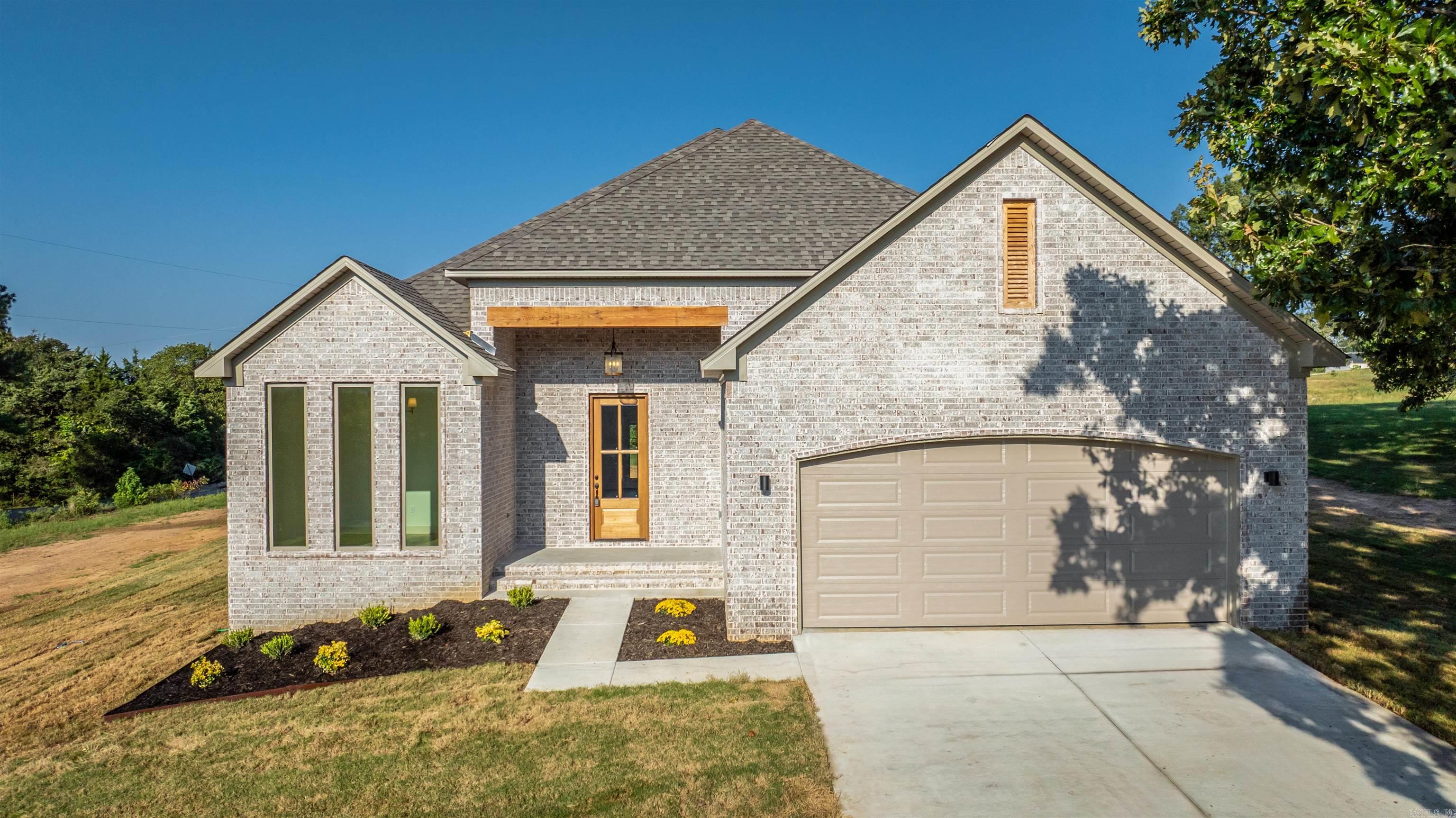 Come home to this stunning new construction in the heart of Greenbrier! This custom-built beauty features an open-concept living area with a vaulted ceiling, granite countertops throughout (even in the laundry room with a folding table!), industrial-strength LPV flooring, and charming front and back outdoor spaces with a porch and patio. The master suite boasts a spacious closet and a luxurious tiled walk-in shower, while elegant moldings accent the living room and master bedroom. Thoughtfully designed for both style and function, this home is ready to become your sanctuary. Taxes estimated based on the lot.
