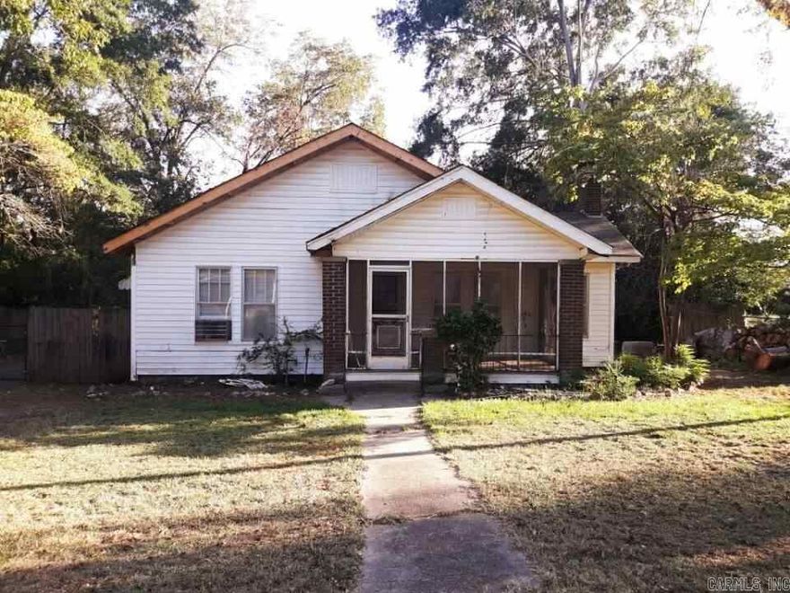 Looking for more space? Enjoy the large indoor and outdoor space in this 2 bedroom 2 bathroom home!  2 living area, a screen enclosed porch, and a workshop with an unfinished living area are just a few of the unique amenities of this older home sitting on a large fenced in lot with nice trees for shade.  Let's get your showing scheduled soon so you don't miss out on your opportunity to own this place!