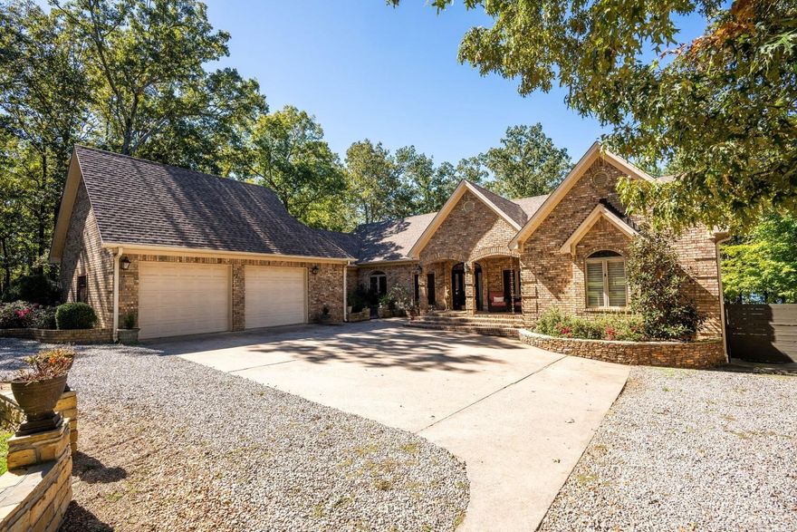 Elegant Lakefront Retreat on Greers Ferry Lake!  Enjoy stunning sunsets in this lovely 3-bedroom, 3-bathroom residence!  Nestled right on the shores of Greers Ferry Lake, this property offers an unparalleled lakefront location and a golf course within a 2-minute walk!  Step inside to find soaring tall ceilings complemented by exposed beams, creating a warm and inviting atmosphere. High-end travertine flooring with Pella doors and windows that flood the spaces with natural light.  The master suite, with lake views, is a true sanctuary, boasting a luxurious en-suite bathroom equipped with a shower and a jetted tub.  Multiple living areas provide ample space for entertaining or cozy family gatherings...plus an additional office/workout room downstairs.  Wet-bar, laundry room with sink, double-sided fireplace, wooden ceilings, barrel ceiling in dining, plenty of storage, 2-car garage, multi-level back deck.   Roof is less than 5 years old, all 4 HVAC units are new in the last 4 years...the full-time residents have taken great care of the property!