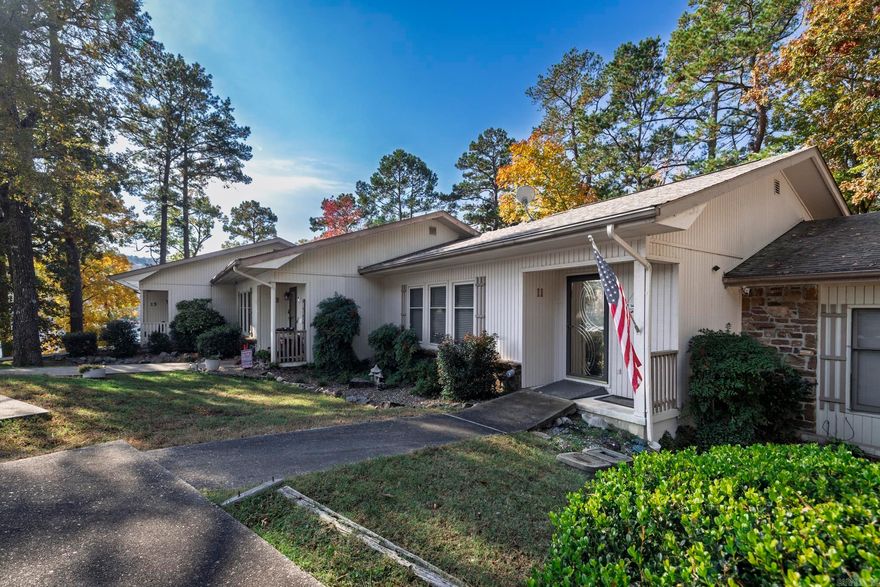 LAKE LIVING.  This 3 bedroom lakefront townhome in popular Madrid Courts is a gem.  Newer carpet, and LVP, roof 5 years old, walk in shower 1 year old, freshly painted and ready for new owner.   This home includes 4 very good size bedrooms, Arkansas room off dining, covered deck on entry level and covered patio on lower level.   Ceiling fans, lazy Susans, spacious closets and so much more.  Laundry has room for storage/workshop.  INCLUDES DOCK, PONTOON, LIFT, 2 KIDS KAYAKS AND 2 ADULT KAYAKS.  Don't miss out on this exceptional buy in beautiful Hot Springs Village.  Property will be sold furnished.  There are a few sentimental family items that will go but most everything stays with the home. Hot Springs Village boasts 9 golf courses, 11 lakes, pickleball, hiking trails, white sand beach, tennis, fitness center, indoor and outdoor pools and so much more.  Half an hour from Hot Springs or Benton and one hour from Little Rock airport. HSV has one time $2000 buy in for new residents.