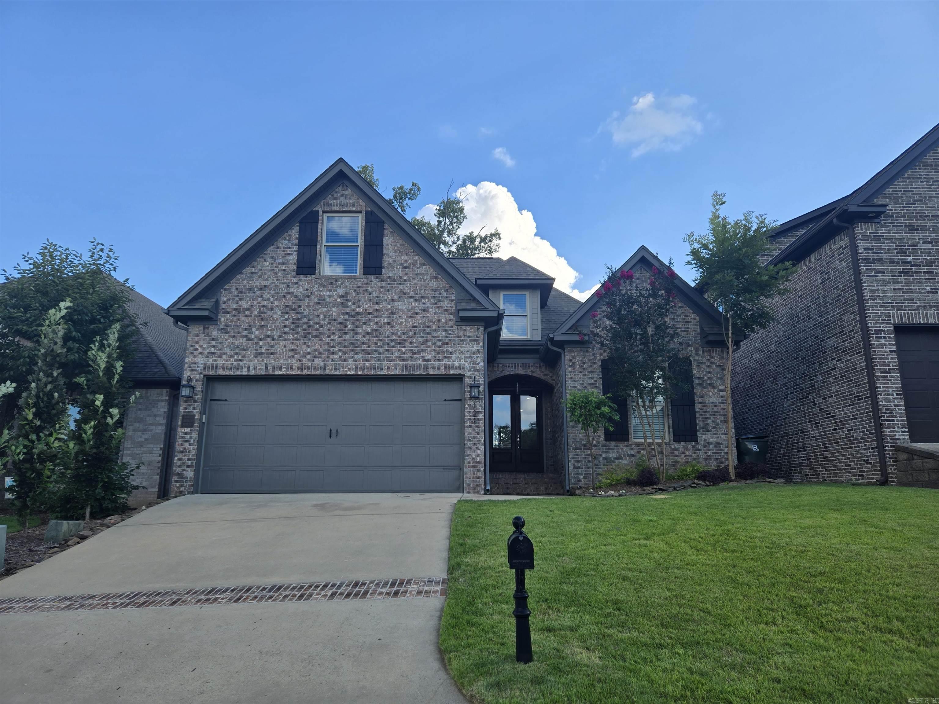 Must see!!! This stunning two-story brick home combines elegance with spacious living in a highly desirable neighborhood. The entry opens through an impressive eight-foot French door into an open layout seamlessly connecting the great room and the massive kitchen. The great room features spacious windows creating an abundance of natural light. The beautiful kitchen offers granite countertops, stainless steel appliances including a GE gas range, oven, microwave and a dishwasher. This home takes full advantage of its square footage and lives really big! The 10' ceilings throughout the entire main floor also make the home feel really roomy. The newly updated flooring and colors make this house really breath taking. The master bath offers his and her sinks, a spacious shower, and a private water closet. There are two bedrooms on the main level and an additional two bedrooms upstairs. The game room over the garage is very large and fantastic for much fun but quiet to the rest of the house all at the same time. This home has an abundance of storage throughout. Come see this perfect fit today!