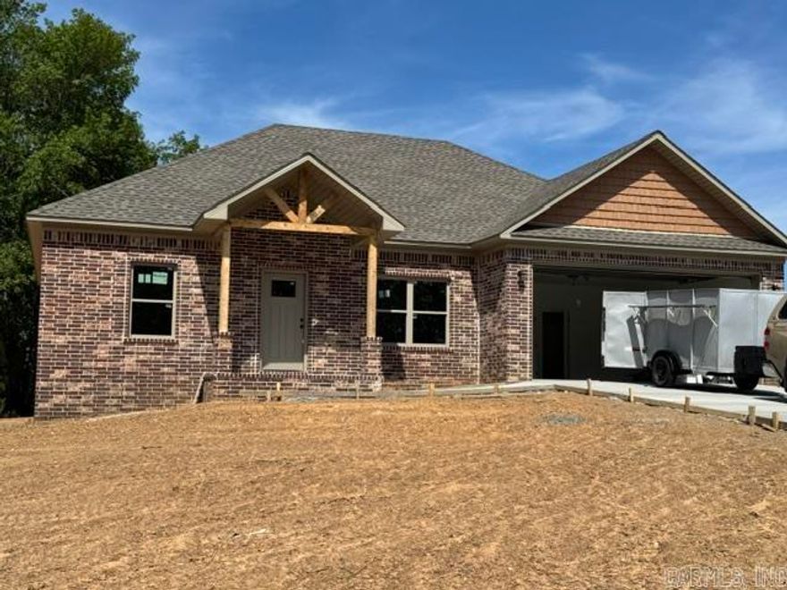 Brand new construction with modern style and thoughtful design! This 3-bedroom, 2-bath home features an open-concept layout with a spacious living area, soaring vaulted ceilings, and abundant natural light. The kitchen is designed for both function and style with a large island, custom cabinetry, and ample storage space—perfect for entertaining or everyday living.  The private primary suite offers a relaxing retreat with a double vanity and a walk-in shower. Secondary bedrooms are generously sized with easy access to a full guest bath. Quality finishes throughout include recessed lighting, clean lines, and a neutral color palette.  Enjoy the durability of a full brick exterior, a 2-car garage, and a peaceful setting with room to spread out. Don’t miss this chance to own a beautiful new home soon to be completed!