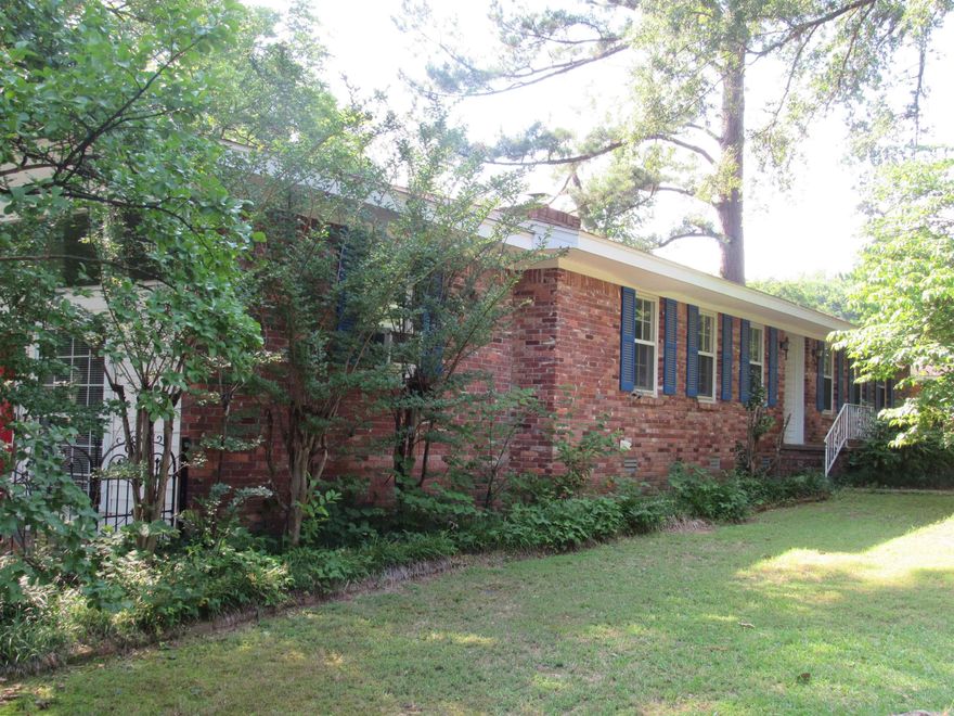 The flexible floorplan on this home affords you privacy while also giving you several areas to entertain.  Several multi-use rooms to fit your lifestyle.  Enclosed garage is heated and cooled with a mini-split and can be returned to a garage very easily.  There is a huge walk-in closet with shelving off this room.  On the back of the house is a spacious sunroom with a mini-split for heat and air and a gas wall heater for backup heat in a power failure.  Large living room as you enter the home and a den/dining room off the kitchen.  In the past few years seller has added some laminate flooring, new wall oven, new faucet and sprayer in kitchen. Electrician replaced all outlets and switches.  Fireplace in den was converted to gas logs.  Wood shutters instead of blinds in most rooms.