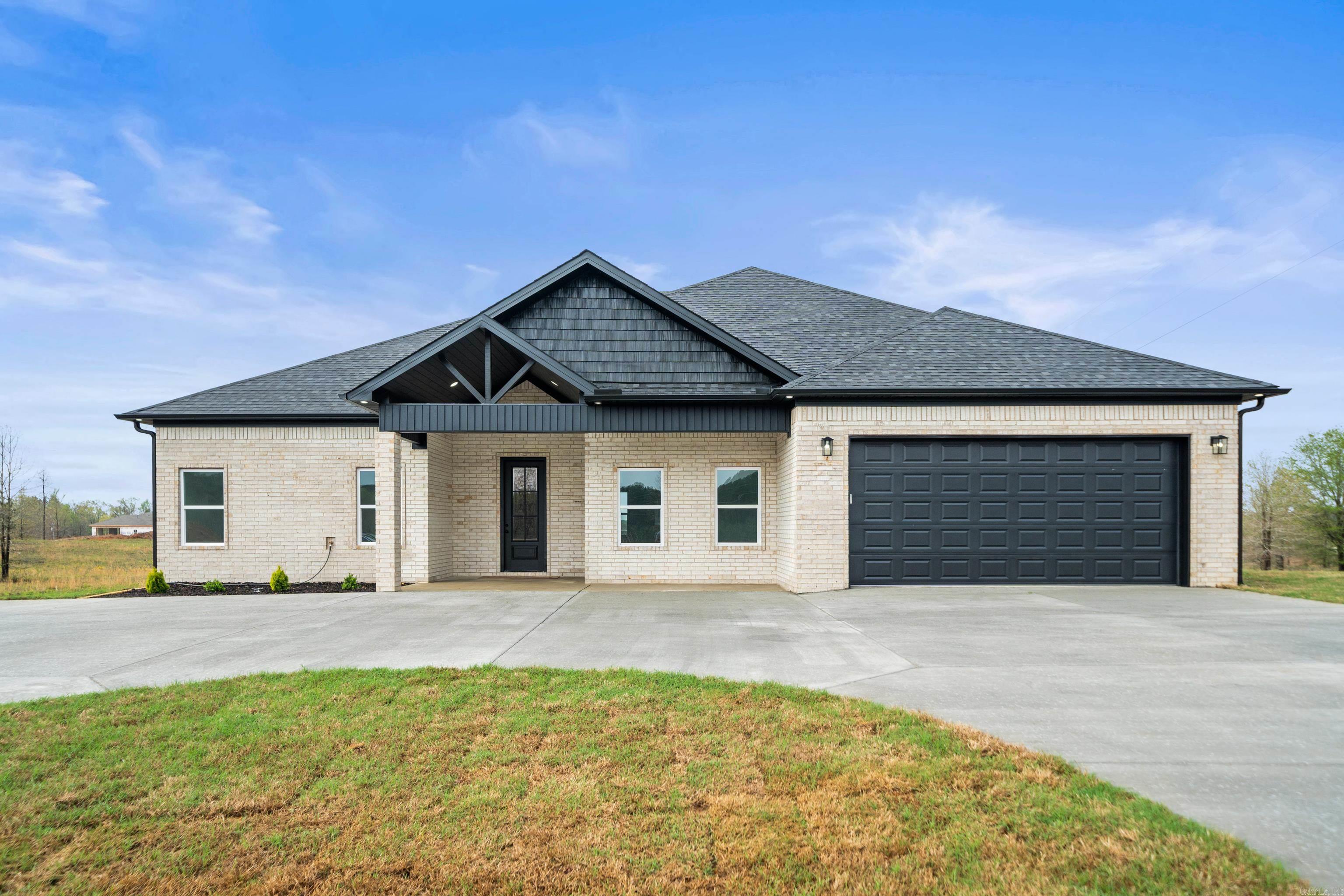 MOTIVATED SELLER! ASK ABOUT BUILDER INCENTIVES! Escape to serenity with this stunning 2,360 square-foot home, set on an 1 acre of land in a peaceful, rural setting just outside the city of Bauxite. Surrounded by natural beauty, this property offers the perfect blend of modern comfort and countryside charm. Step inside to to discover a thoughtfully upgraded interior designed for both relaxation and entertainment. The open-concept living area boasts high ceilings, abundant natural light, and a cozy fireplace. The gourmet kitchen includes granite counter tops and soft close cabinets. Spacious bedrooms provide serene retreats while, with the primary suite features a luxurious en-suite bath complete with a soaking tub and walk-in shower. Outside the expansive backyard invites endless possibilities, while a beautiful circle drive welcomes you home. Perfect for those seeking privacy without sacrificing modern conveniences, this rural gem is a rare find. Schedule your private tour today! AGENTS SEE REMARKS.