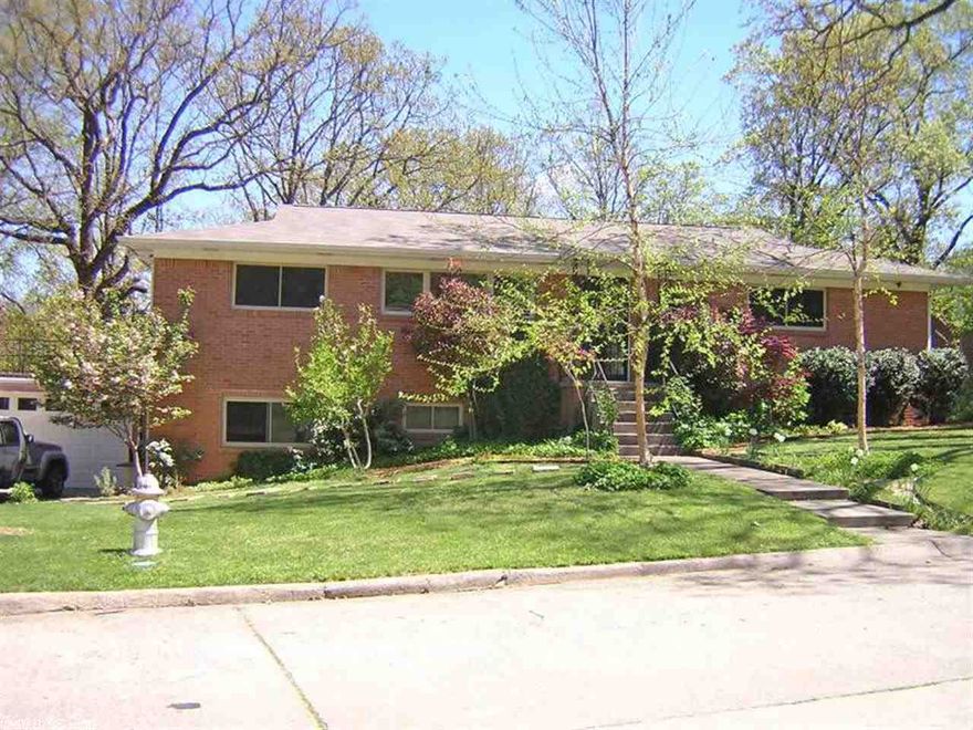 Mid-Century Updated! Fantastic location near lakes, parks, schools, and shopping. Move-in ready with hardwood floors and fresh paint throughout--3 large bedrooms and 3 full baths. Lots of storage--2 car garage with new garage door, huge closets including a large walk-in which could be used as a bonus room, attic storage. Remodeled kitchen with cork floor and butcher block counters. Updated bathrooms and including a claw-foot tub in master bath. New windows and new patio door, updated electric, and new heat