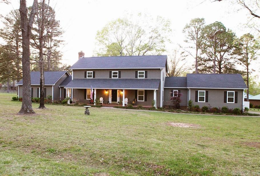 Exquisite 4-bed/ 3.5 bath Colonial Revival home on a level acre corner lot, blending luxury & comfort. Features two primary suites, including a main-level suite w/ two walk-in closets, and a beautifully remodeled bathroom. The main floor boasts a stunning living room w/ fireplace, spacious galley kitchen w/ breakfast nook, formal dining room, laundry/pantry, half bath, & a bonus room ideal for a library. Upstairs offers one large primary suite, two additional bedrooms, and a full bath. Enjoy an amazing patio and huge fenced back yard, perfect for privacy and entertaining. Upgrades include all new windows & coverings, new shingles & gutters, new furnaces, a new air conditioner, complete interior paint throughout, new doors, & much more. Don't miss this modernized jewel on expansive land!