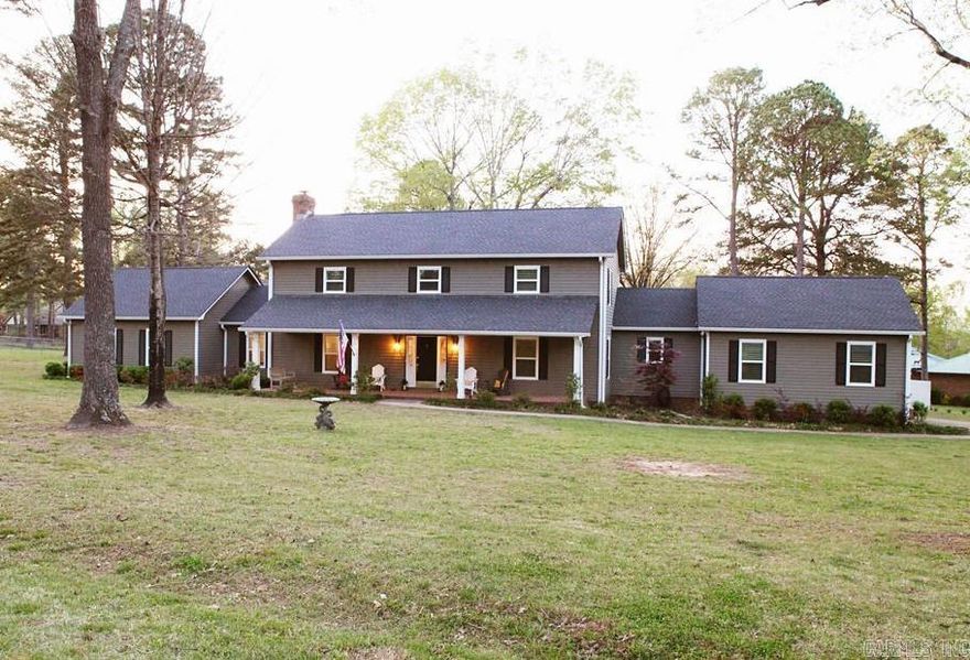 Exquisite 4-bed/ 3.5 bath Colonial Revival home on a level acre corner lot, blending luxury & comfort. Features two primary suites, including a main-level suite w/ two walk-in closets, and a beautifully remodeled bathroom. The main floor boasts a stunning living room w/ fireplace, spacious galley kitchen w/ breakfast nook, formal dining room, laundry/pantry, half bath, & a bonus room ideal for a library. Upstairs offers one large primary suite, two additional bedrooms, and a full bath. Enjoy an amazing patio and huge fenced back yard, perfect for privacy and entertaining. Upgrades include all new windows & coverings, new shingles & gutters, new furnaces, a new air conditioner, complete interior paint throughout, new doors, & much more. Don't miss this modernized jewel on expansive land!