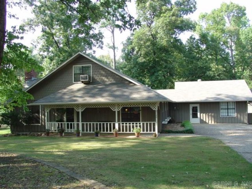 Inviting country style home with large front porch.  Lots of updating with neutral paint and new floor covering in much of the home.  Greatroom includes stained wood cathedral ceiling with brick fireplace.  MBR is down with 3 large closets - one large enough for sewing, etc.  Big mud-room connects oversized study/workshop.  Includes a detached garage and two outbuildings + a safe room.  Just outside town with a little breathing room inside and out. See Agent Remarks.
