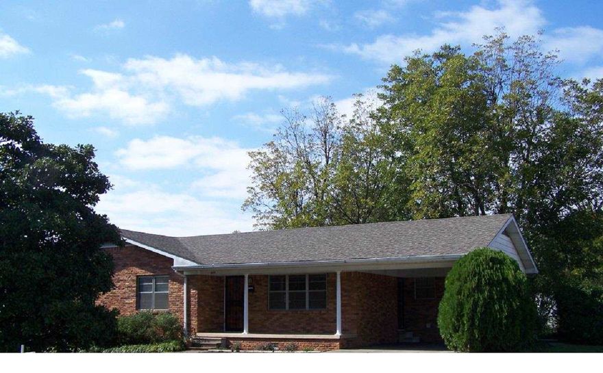 Three bedroom, 1 1/2 bath, spacious kitchen/dining, large living room, laundry room, utility room, single carport, outside storage building, chain link fence, corner lot. See agent remarks.