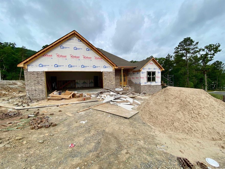 Be one of the first to live in Chenal’s new upscale neighborhood of COURAY COURT.  This wonderful Hartness built home is adjacent to dictated green space.  This one level home features an open floor plan with high ceilings, hardwood floors and custom cabinetry throughout.  Each of the three bedrooms are en-suites with walk in closets.  In addition, this home features a home office and guest powder bath.  Great storage throughout.  Completion mid-summer, just in time before school starts. Easy to Show.